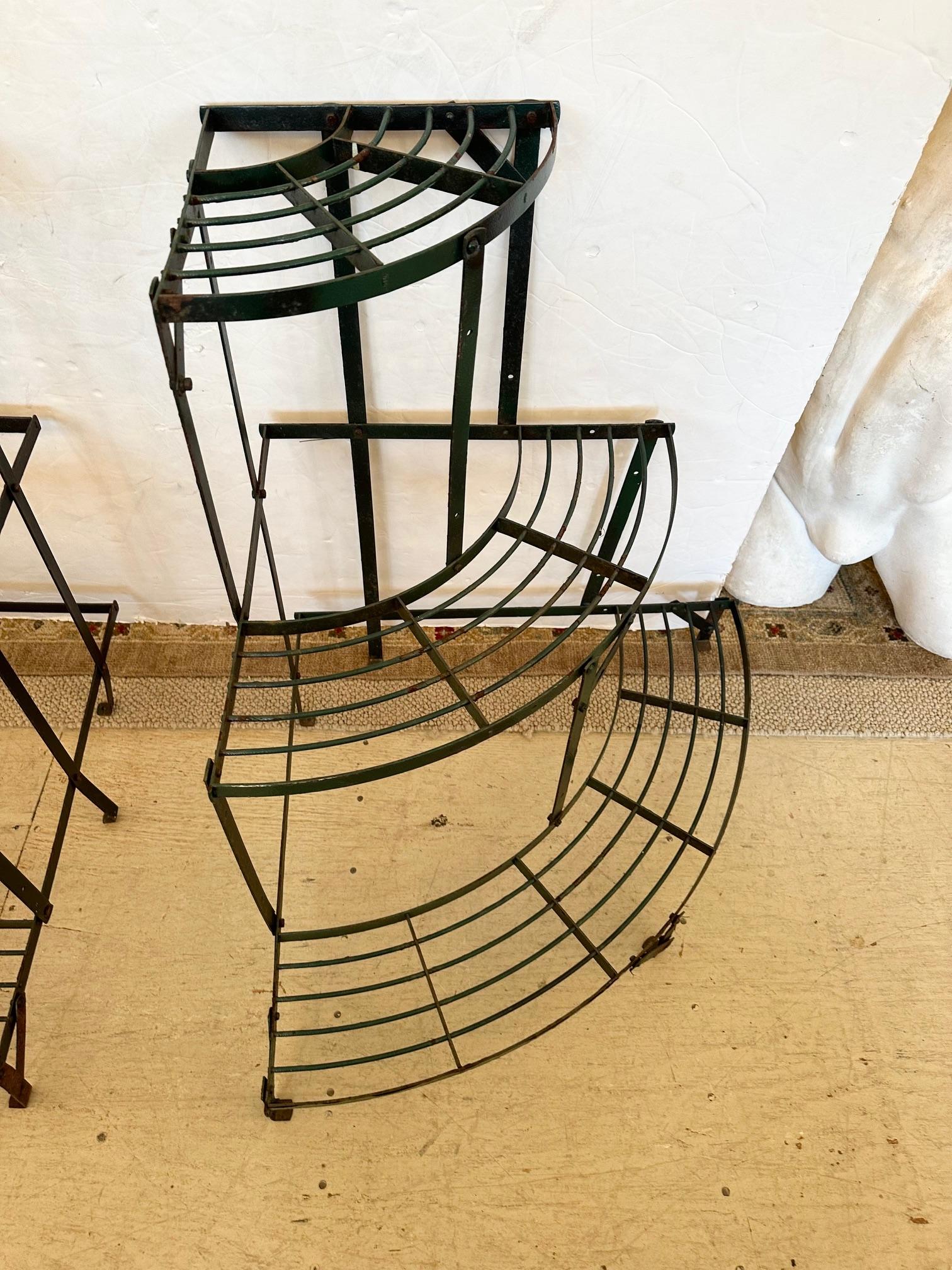 Fantastically versatile dark hunter green metal vintage florist flower/plant stand having 3 sections and 3 tiers.  Great curved sides give it an elegant shape.
Top shelf 11” D 
Middle shelf 6.5” D 
Bottom shelf 6.5” D