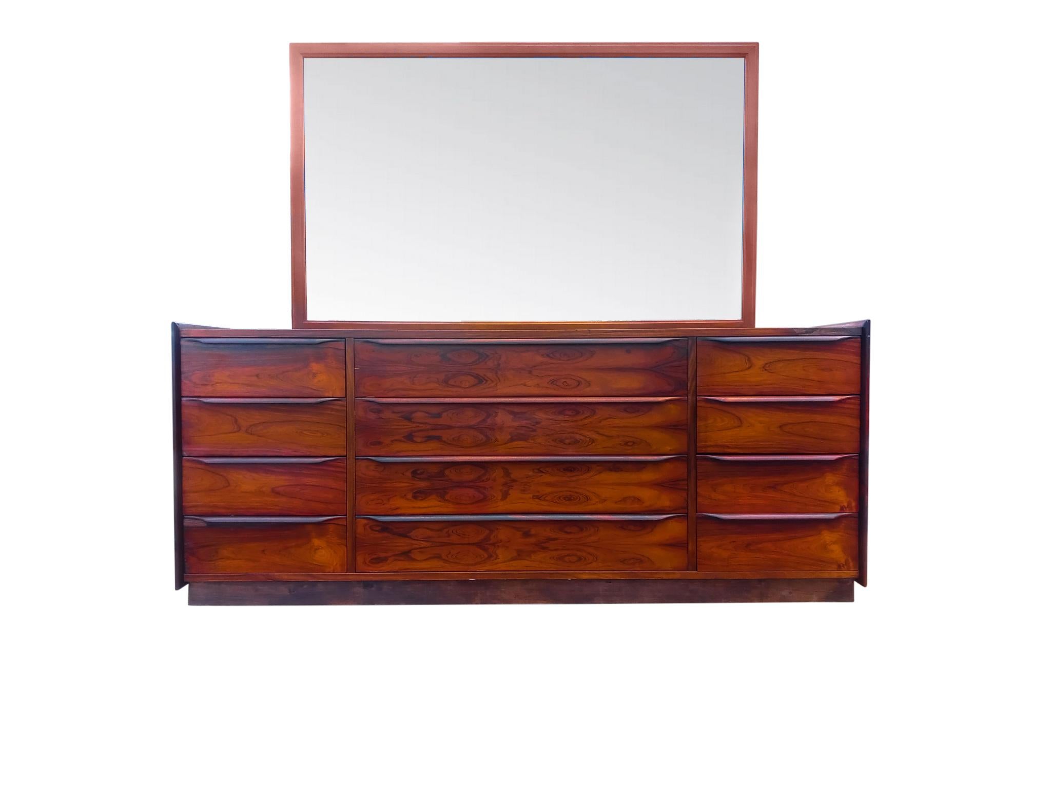 Wow, 12 gorgeous drawers & sleek cabinet in top grain and super expressive rosewood! And mounted too is a large teak frame mirror. A stunning and practical combo. Notice the sculptured solid rosewood handles. Also the side panels that extend above
