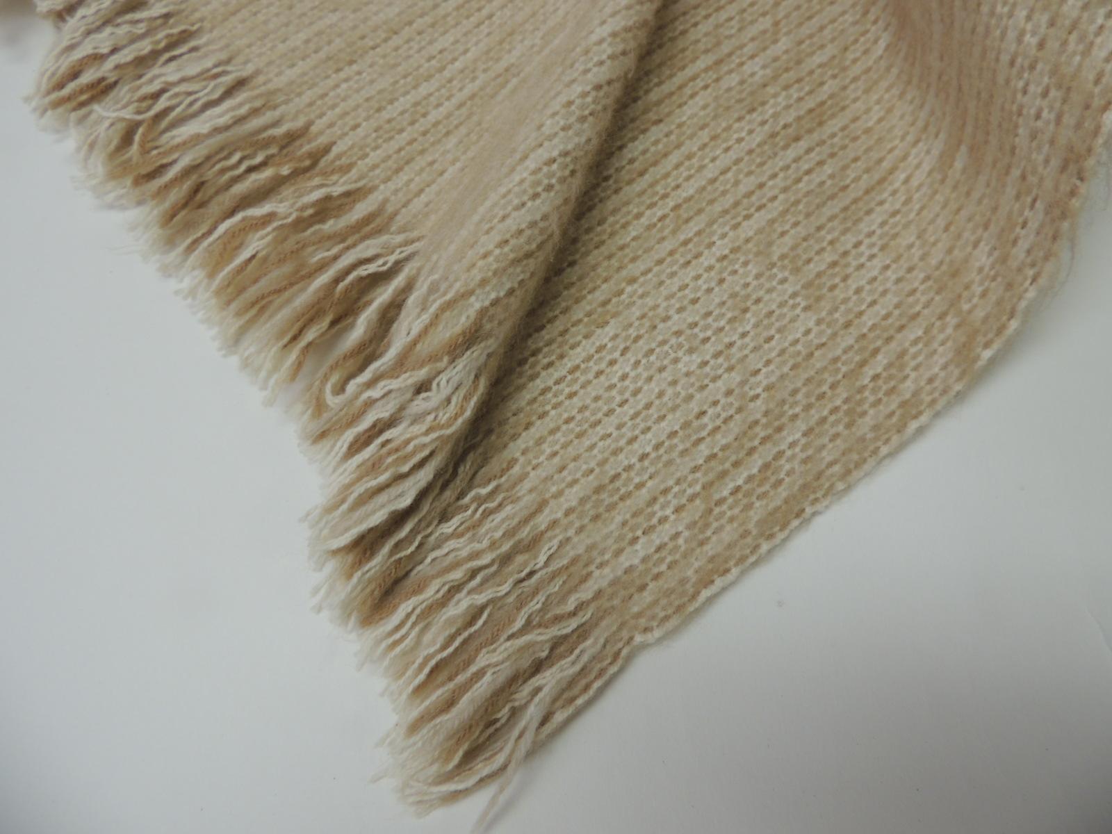 Large vintage thick Ecru color tone-on-tone woven wool and alpaca throw with small fringes on both ends. 
Center seam.  Ideal for the back of a sofa, chair or bed.
Size: 46 x 70.
