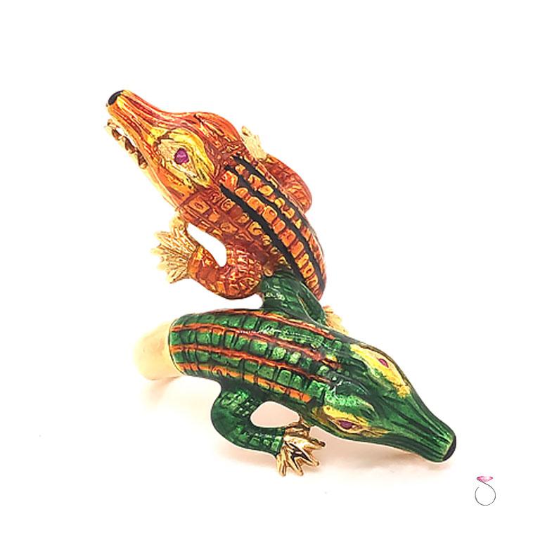 Rare Vintage enamel large double Alligator ring from the 1960's. This gorgeous figural ring features beautifully enameled Alligators in vibrant green & orange enamel, the two Alligators bypass each other and feature ruby eyes. This is a large ring