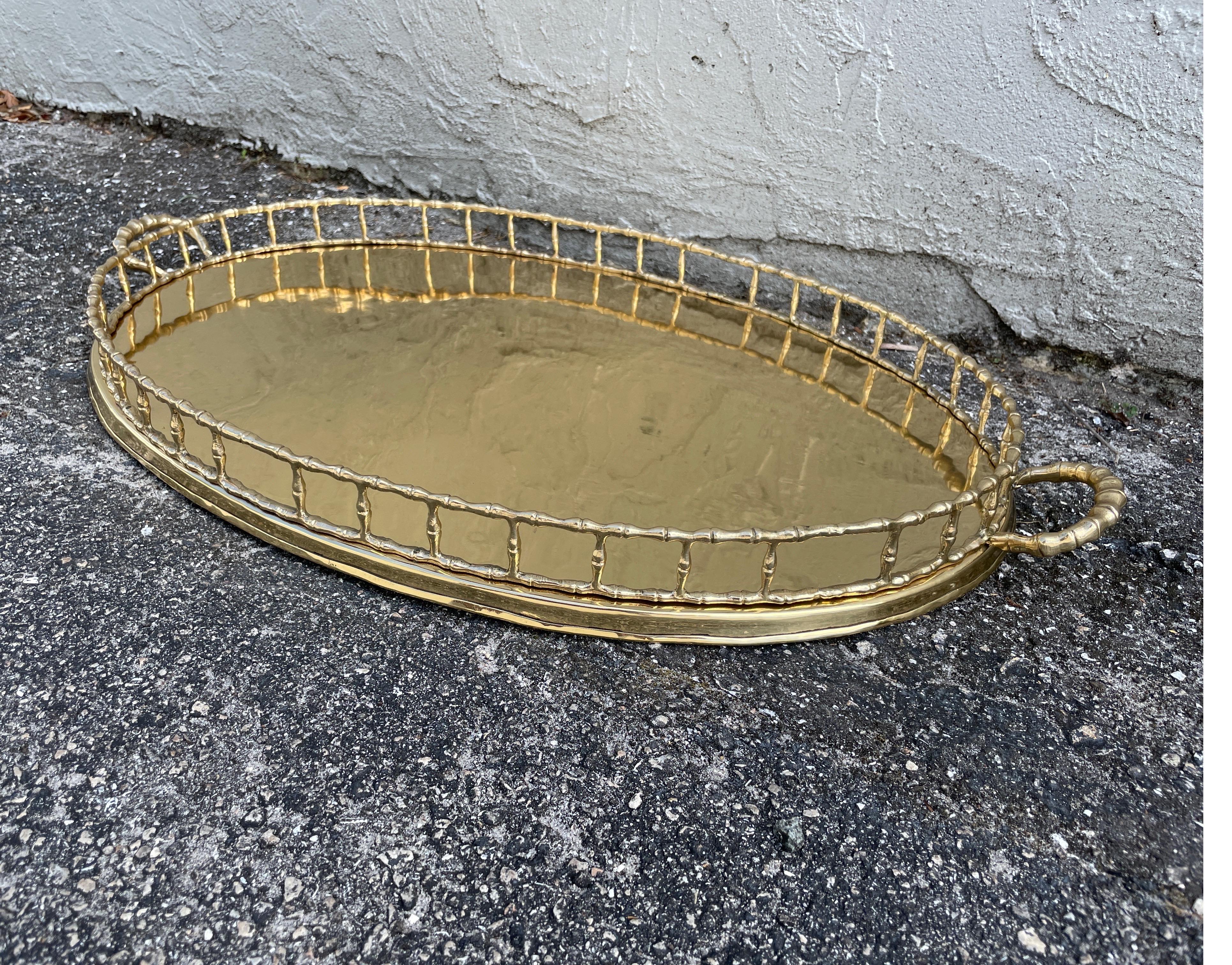 Vintage brass faux bamboo galleried tray with handles. Measures 28