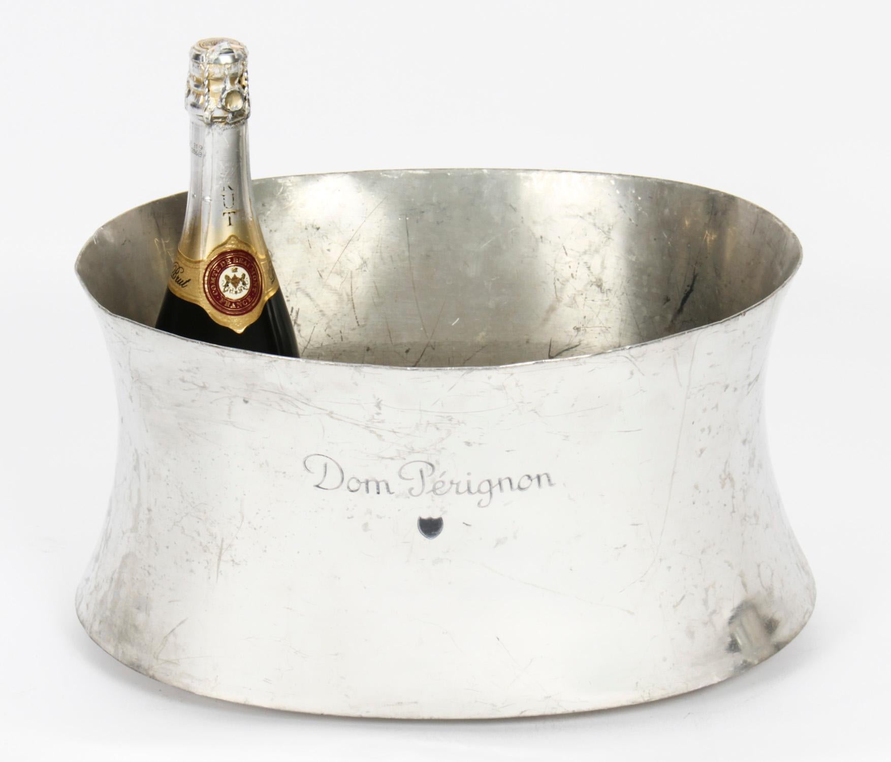 This is a large vintage French Dom Perignon pewter champagne cooler, mid 20th century in date

This well used cooler is suited to a party, and can easily accommodate six bottles. It brings with it a touch of sophistication and class and it is