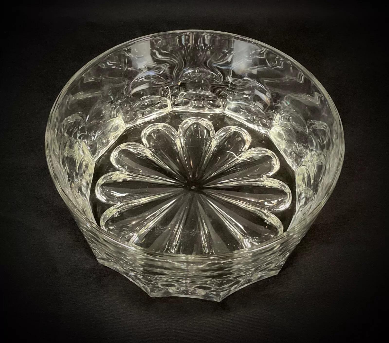 This vintage large glass bowl features a striking symmetrical design, making it a beautiful and functional addition to any home decor. Measuring 8.7 inches (22 cm) in diameter and 3.7 inches (9.5 cm) in height, this elegant glass bowl weighs 3.2 lbs