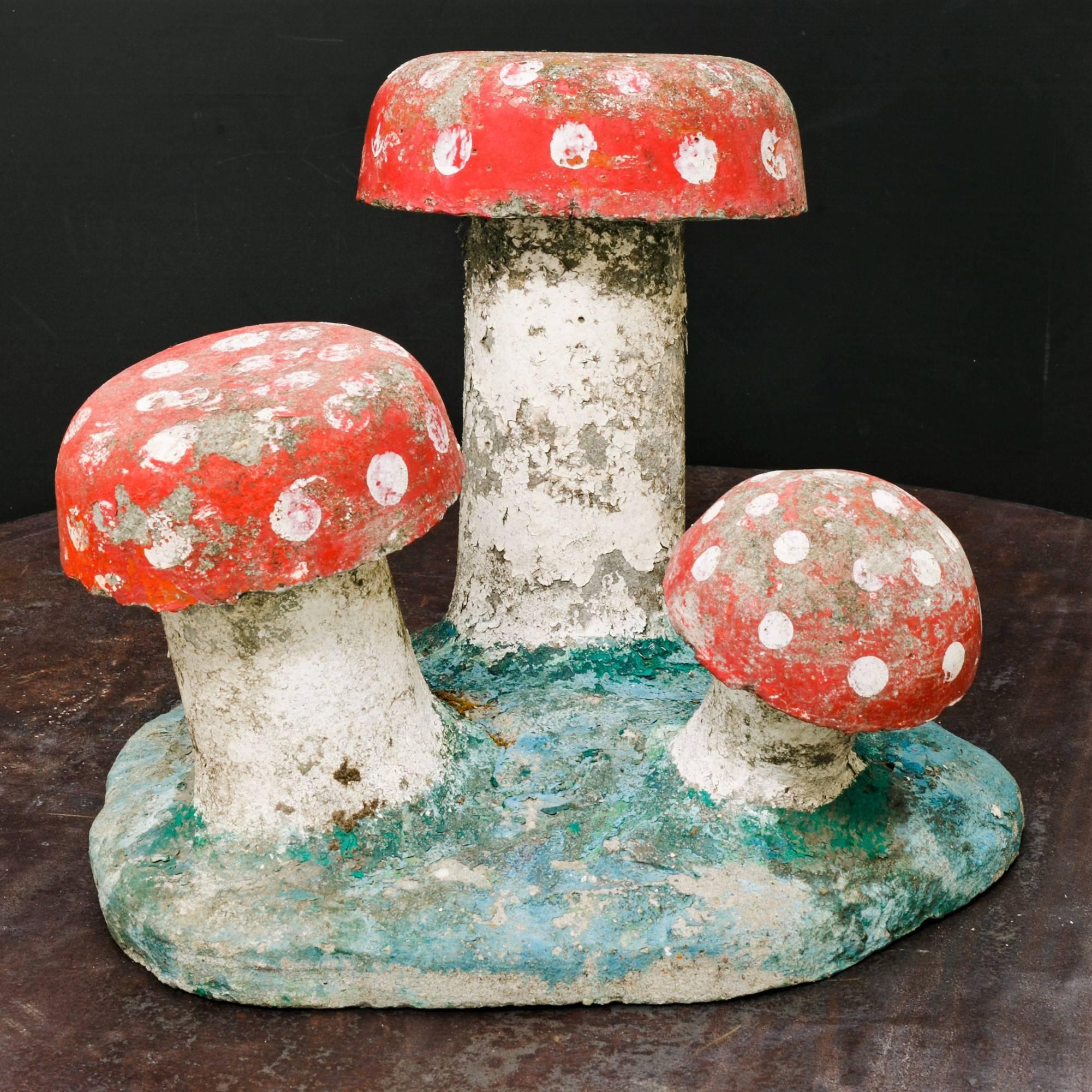 Charming, small hand painted concrete toadstool or mushroom garden sculpture.