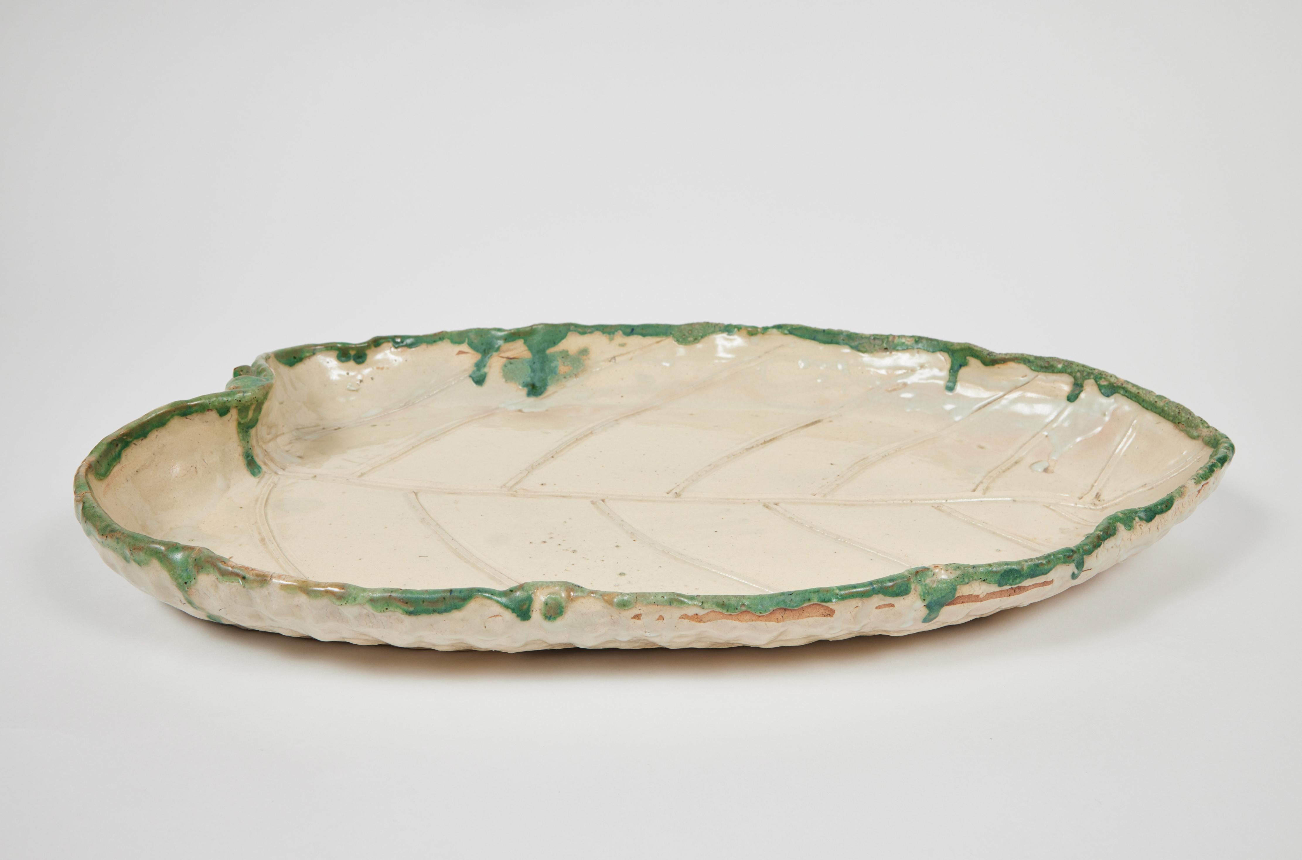 Rustic large vintage Japanese pottery leaf tray is handmade and glazed in a simple and natural fashion.
It mimics the real leaf with a fantastic ability for function.

(Not Food Safe).