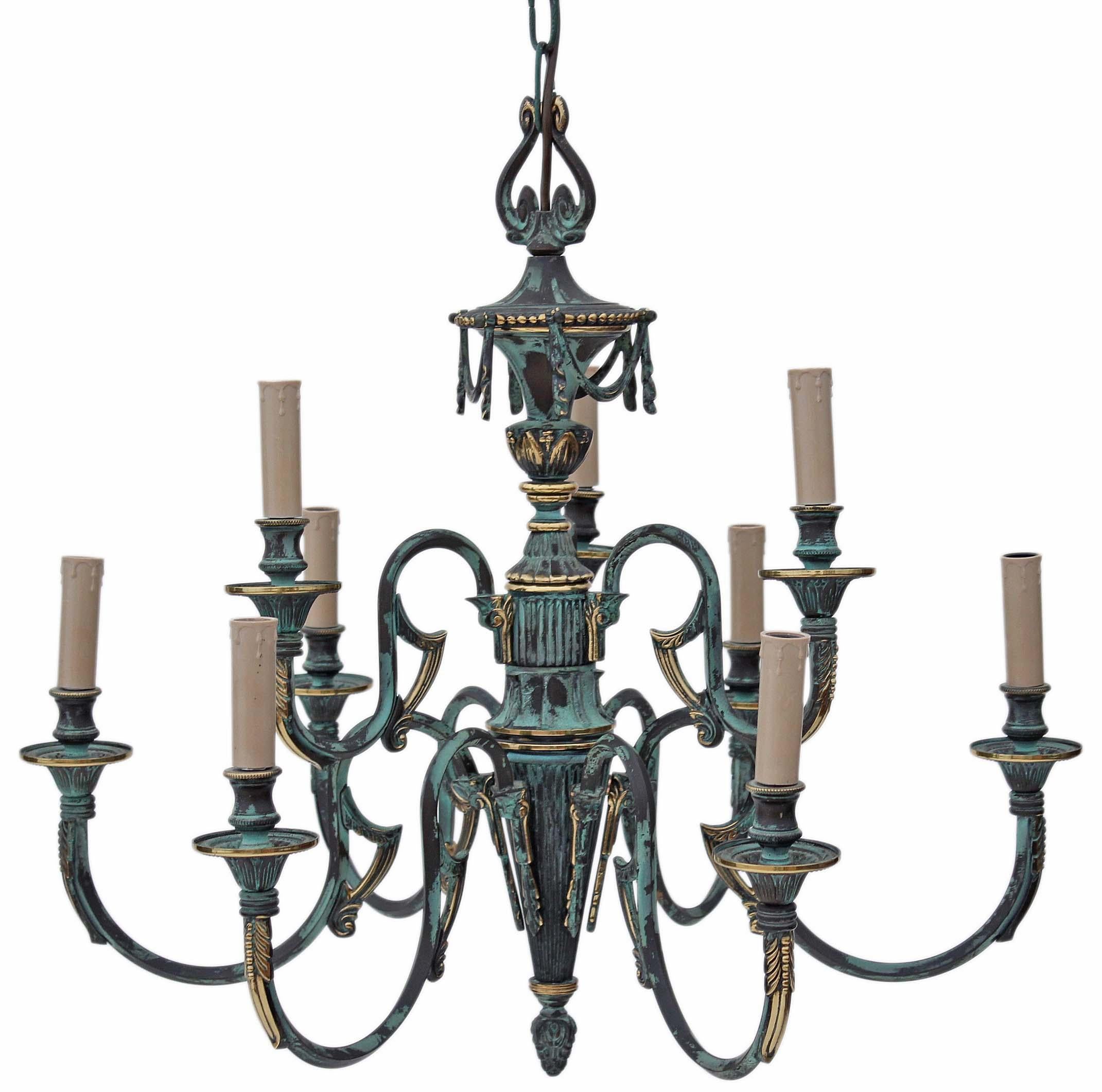 Antique large heavy Gothic 9-lamp brass bronze chandelier.

This striking chandelier, approximately 20 years old, showcases a heavily tarnished brass appearance, possibly featuring other metals, with vert de gris aging.

Sure to command attention