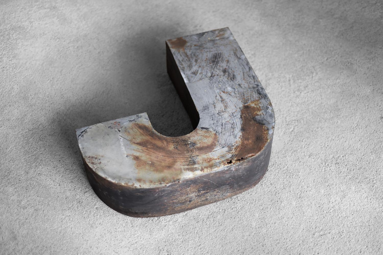 This large, spatial letter J was produced in Poland during the 1950s. It was made of metal. It is an original element of the sign of a former restaurant in Poland, which was exposed outside, hence traces of natural patina. The three-dimensional