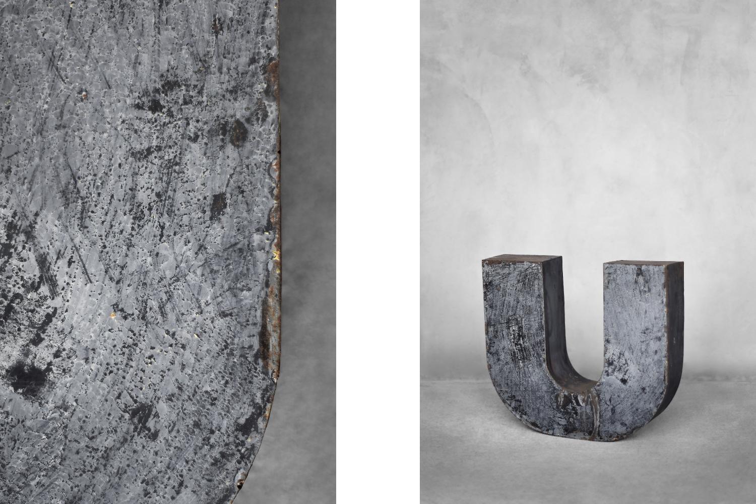 This large, spatial letter U was produced in Poland during the 1950s. It was made of metal. It is an original element of the sign of a former restaurant in Poland, which was exposed outside, hence traces of natural patina. The three-dimensional
