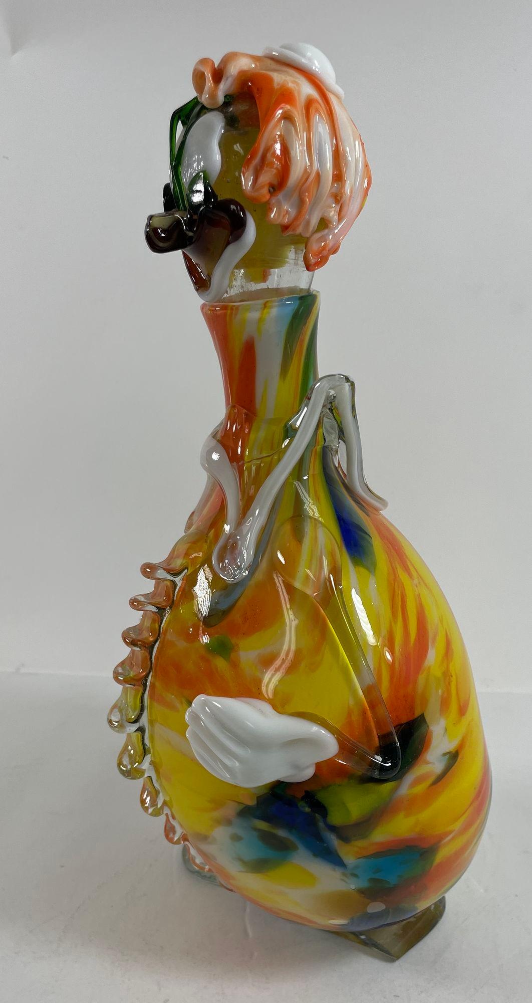Vintage Large Hand Blown Italian Murano Glass Clown Decanter Bottle 13.5” .
Amazing colorful hand blown Murano glass clown decanter with hat and bow tie.
This Italian hand blown Murano glass clown decanter with stopper.
Great art glass work and very