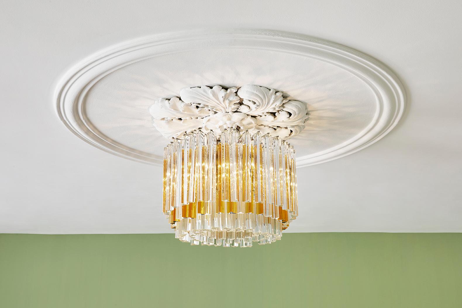 Murano chandelier 
Italy, 1960s

Murano glass chandelier with clear and a couple of Amber tinted glass rods.

Measures: H 48 x 60 Ø cm.
 