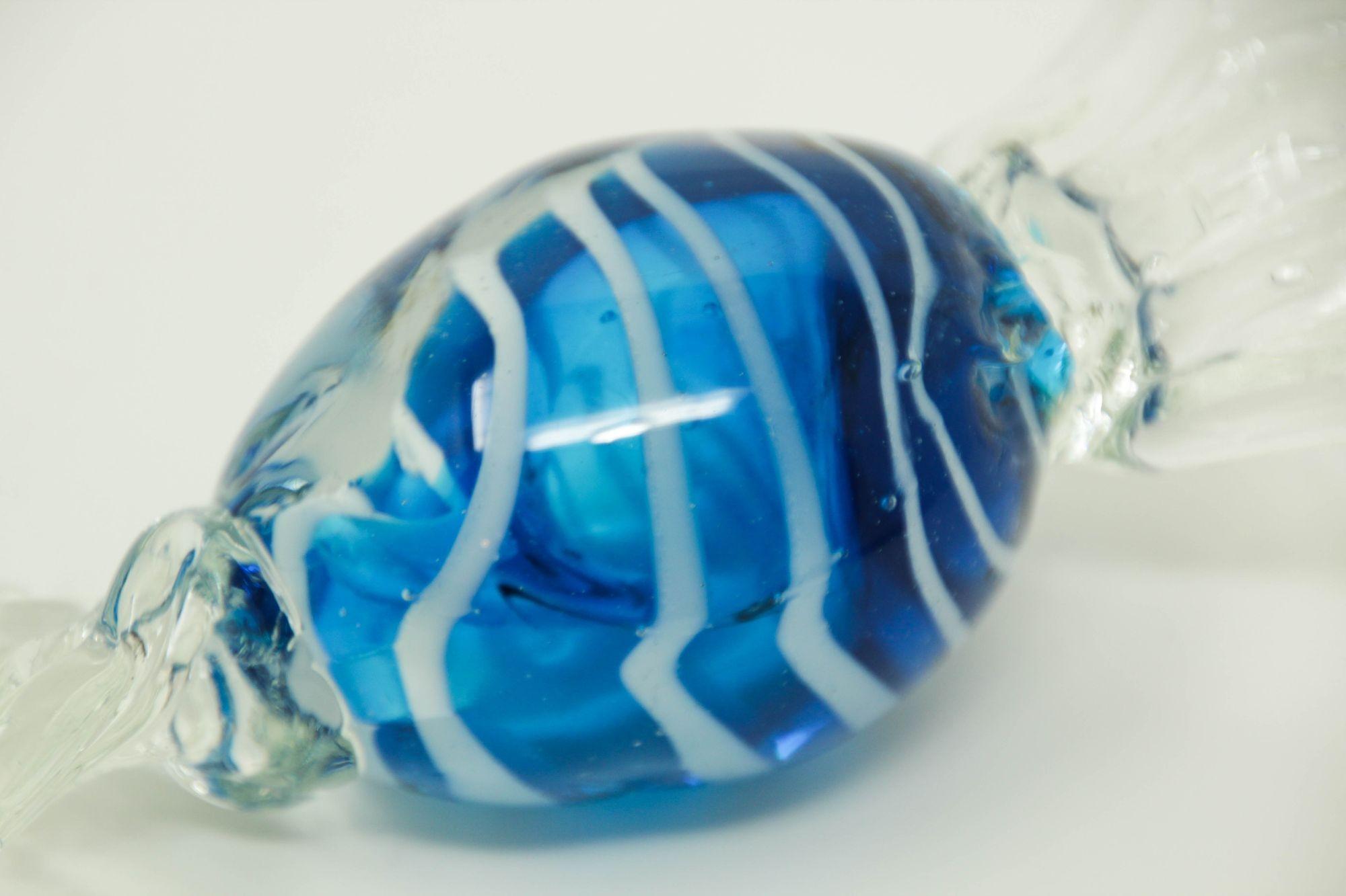 Vintage Large Murano decorative blown art glass wrapped blue hard candy paperweight.
Hand blown blue art glass hand crafted in Italy paperweight candy sculpture.
Vintage oversized Murano blue blown glass candy sculpture of candy wrapped in