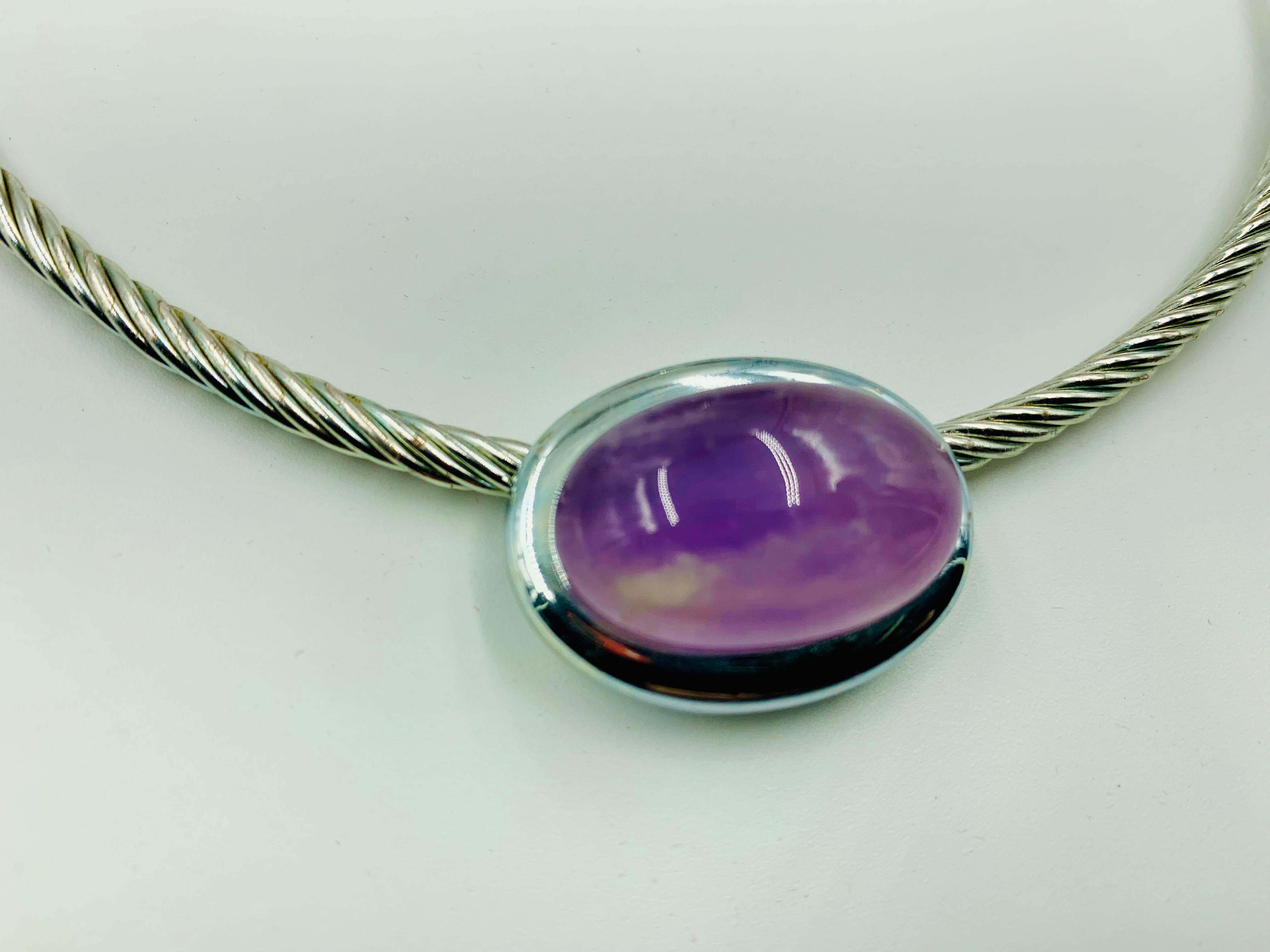 Vintage 1980's signed F. Romana large natural cabochon amethyst silvered metal torque necklace.
Excellent condition, light surface wear commensurate with age
Signed with monogram FR for Francesca Romana
Amethyst measures 25mm by 18mm, the stone with