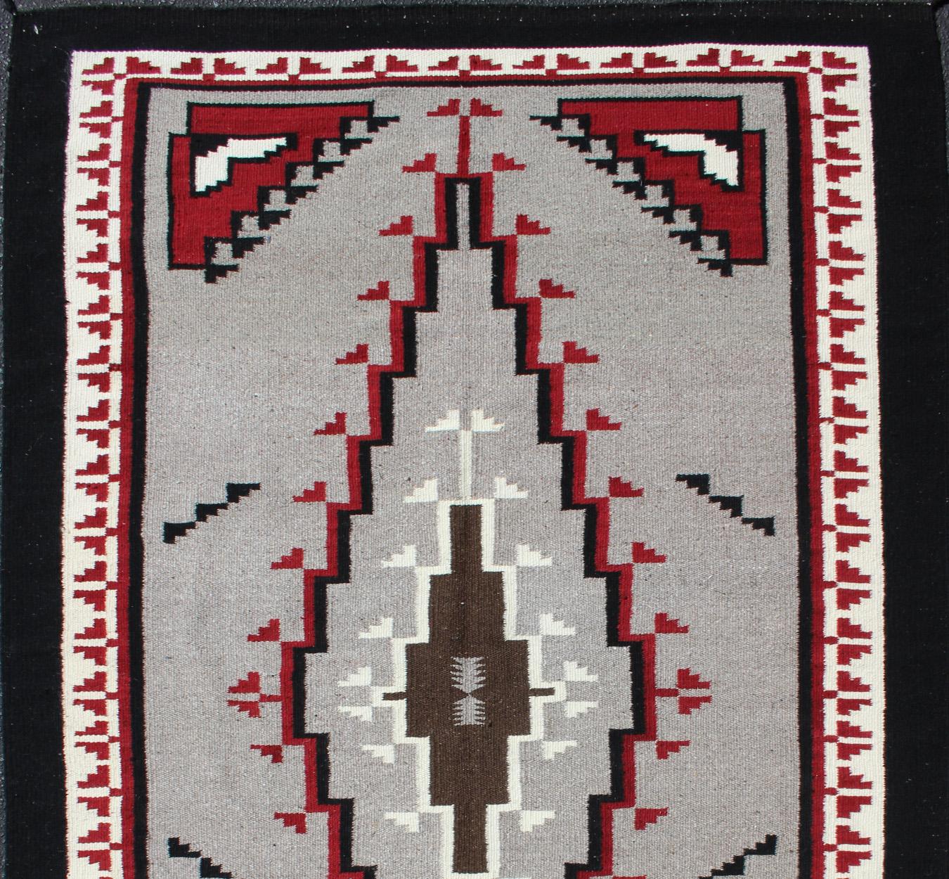 Vintage Tribal Native American Rug in Gray, Ivory, Black, and Red
Large vintage native American rug with geometric design in red, white and black, Keivan Woven Arts/ rug/R20-18, country of origin / type: America / Native American rug, circa