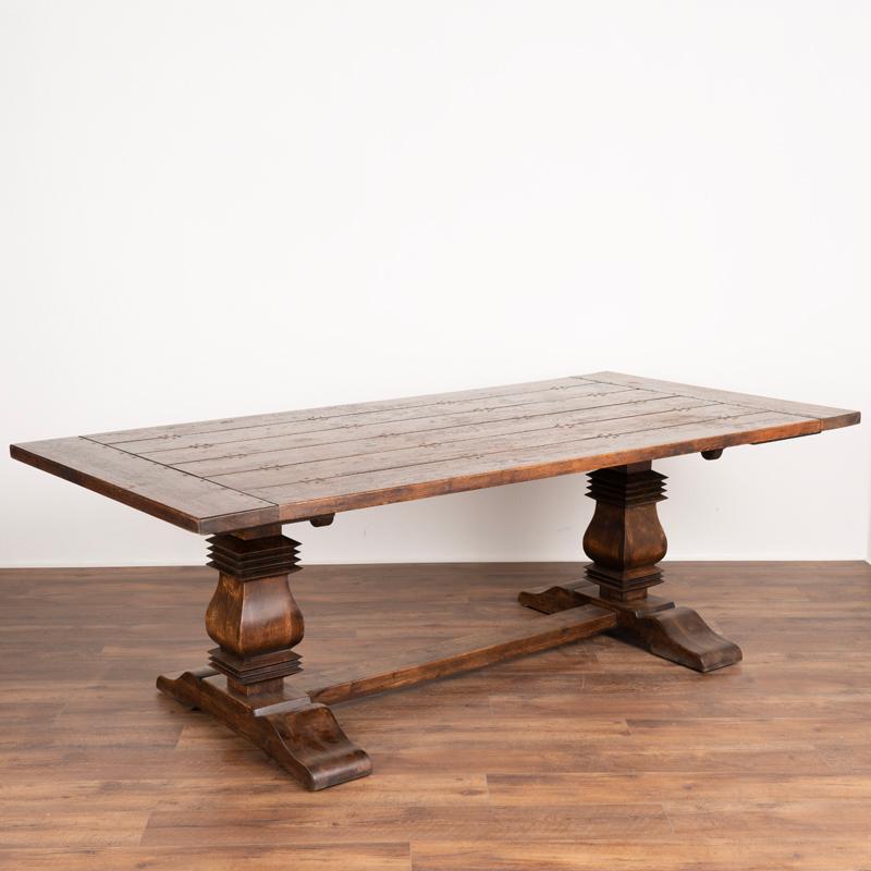 Strong and substantial, this large oak farm table will invite the entire family to sit and linger. Notice the heavy trestle base holding the plank top at 1.75