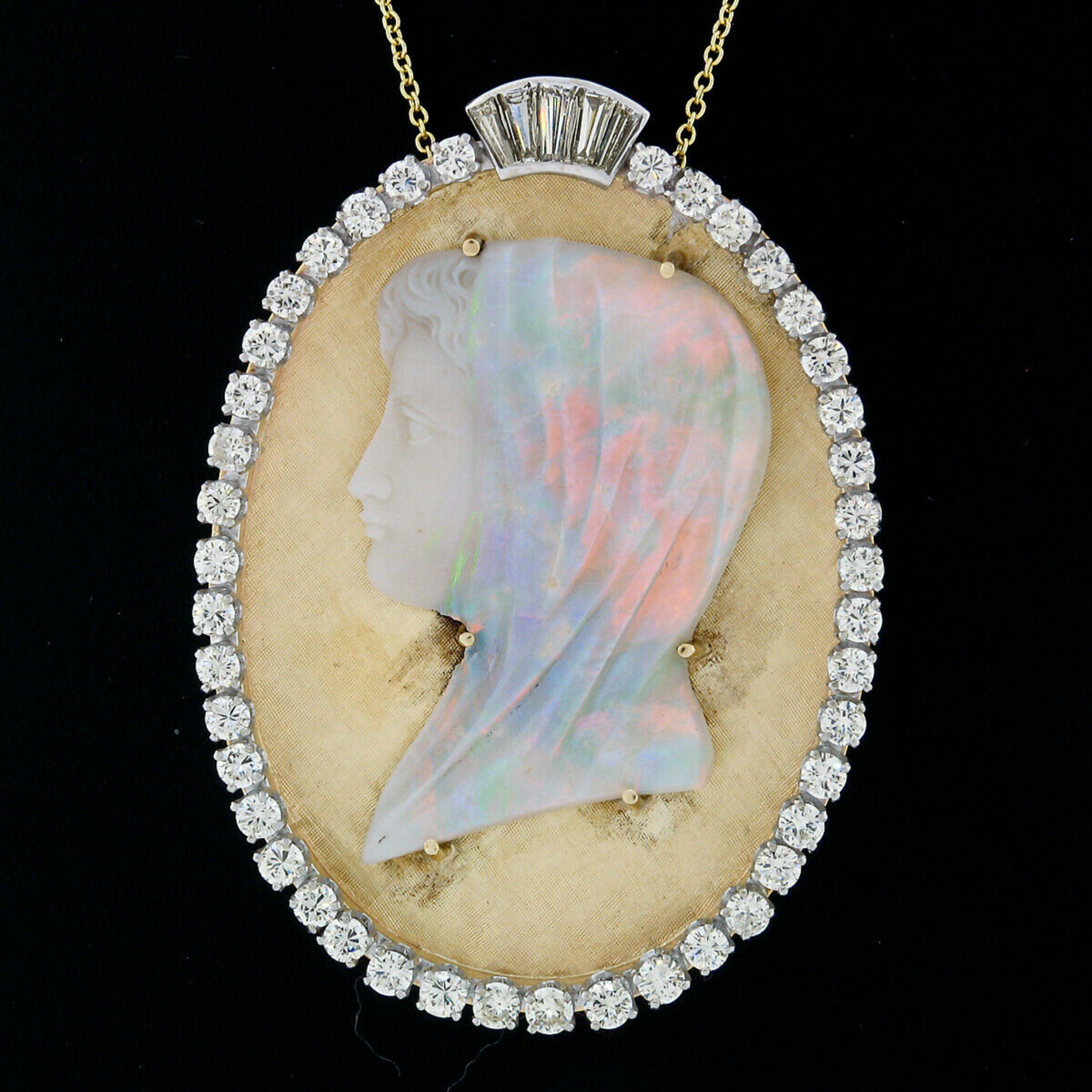 Here we have a large and absolutely stunning vintage pendant that was crafted in solid 14k yellow and white gold. The pendant features a magnificent cameo of a veiled woman which was carved from a single large piece of natural opal. The woman's face