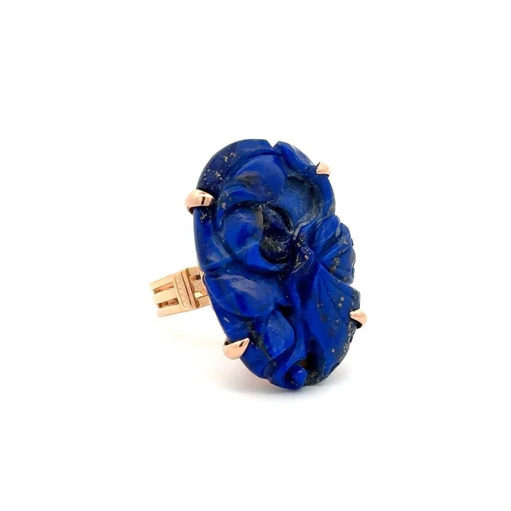 Simply Beautiful! Large Oval Carved Lapis Lazuli Gold Mid Century Modern Cocktail Ring. Centering a securely nestled Hand carved Lapis Lazuli. The ring is Beautifully Hand crafted 14K Yellow Gold mounting. Measuring approx. 1.1” l x 0.7” w. Ring