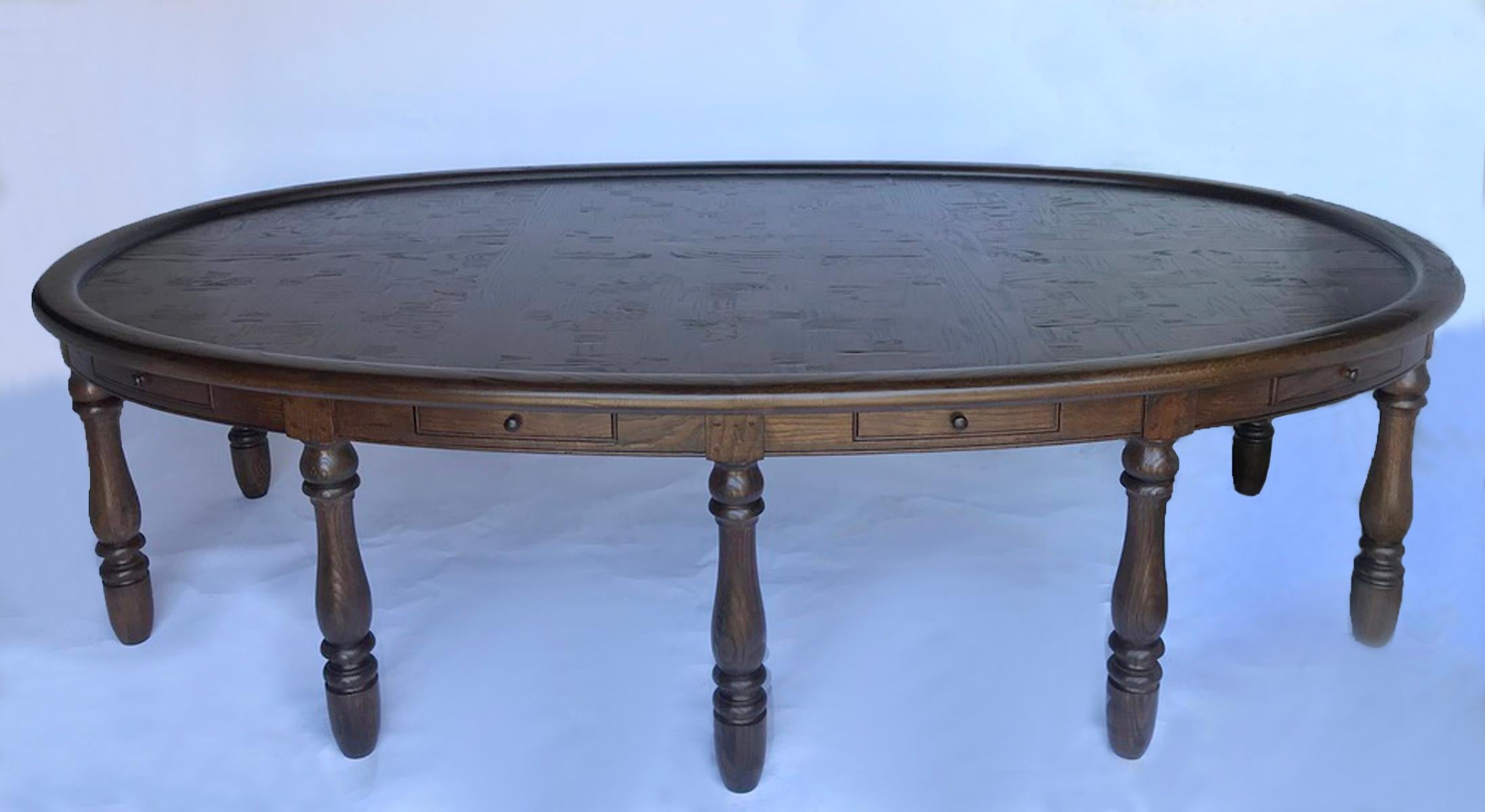 Vintage oval oak table with ten legs and ten drawers. Top has inlaid basketweave motif made from solid pieces of oak, not veneer. Recently finished in a durable finish, but still with a vintage feel. This would be an excellent conference table or