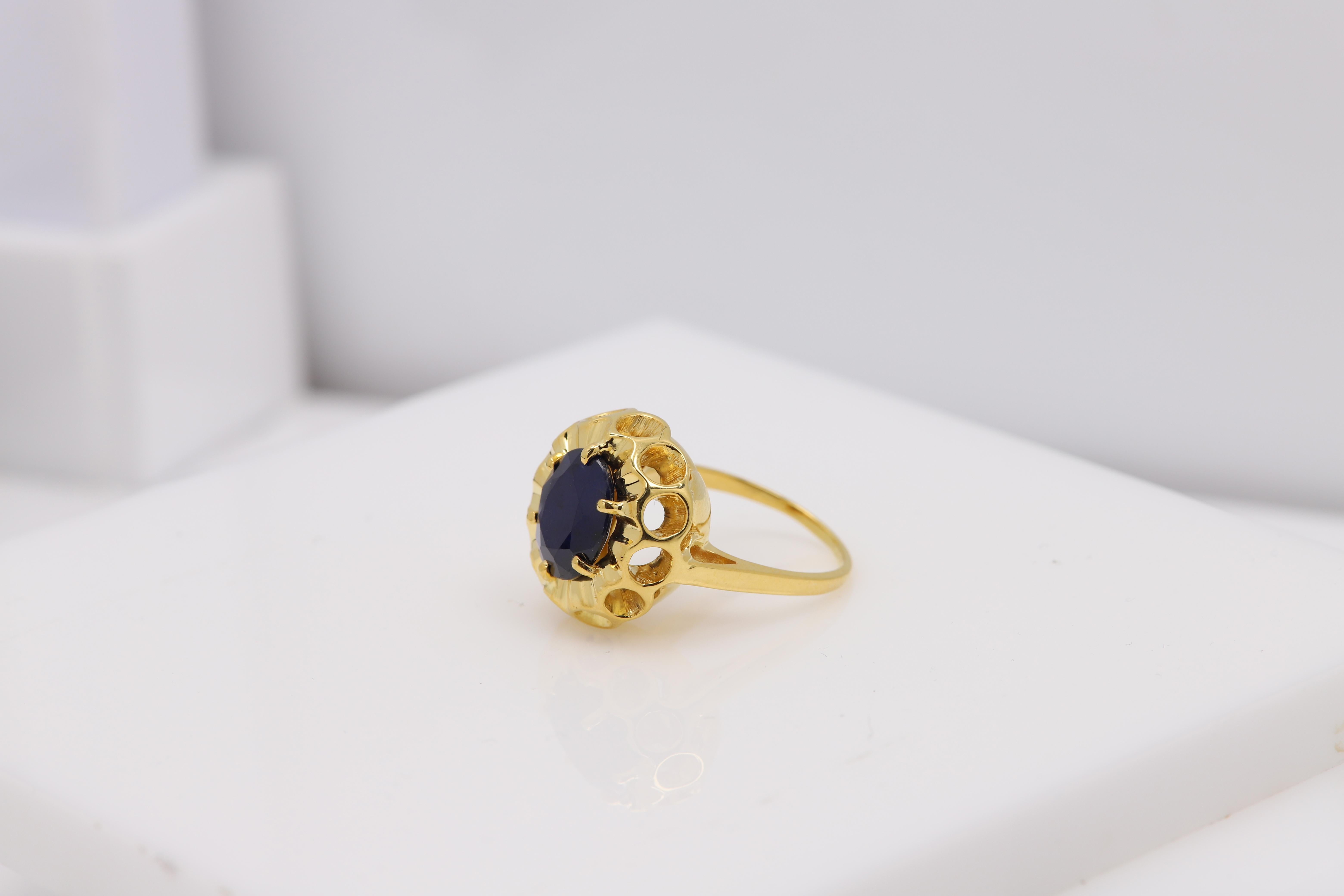 Vintage Sapphire Ring
14k Yellow Gold
Approx weight 7.2 grams
Natural Oval Sapphire size approx 11 x 9 mm 
Finger size 7
overall size from the top area is 18 x 16mm
The Sapphire is opacity on the darker side
this is a real vintage ring that was