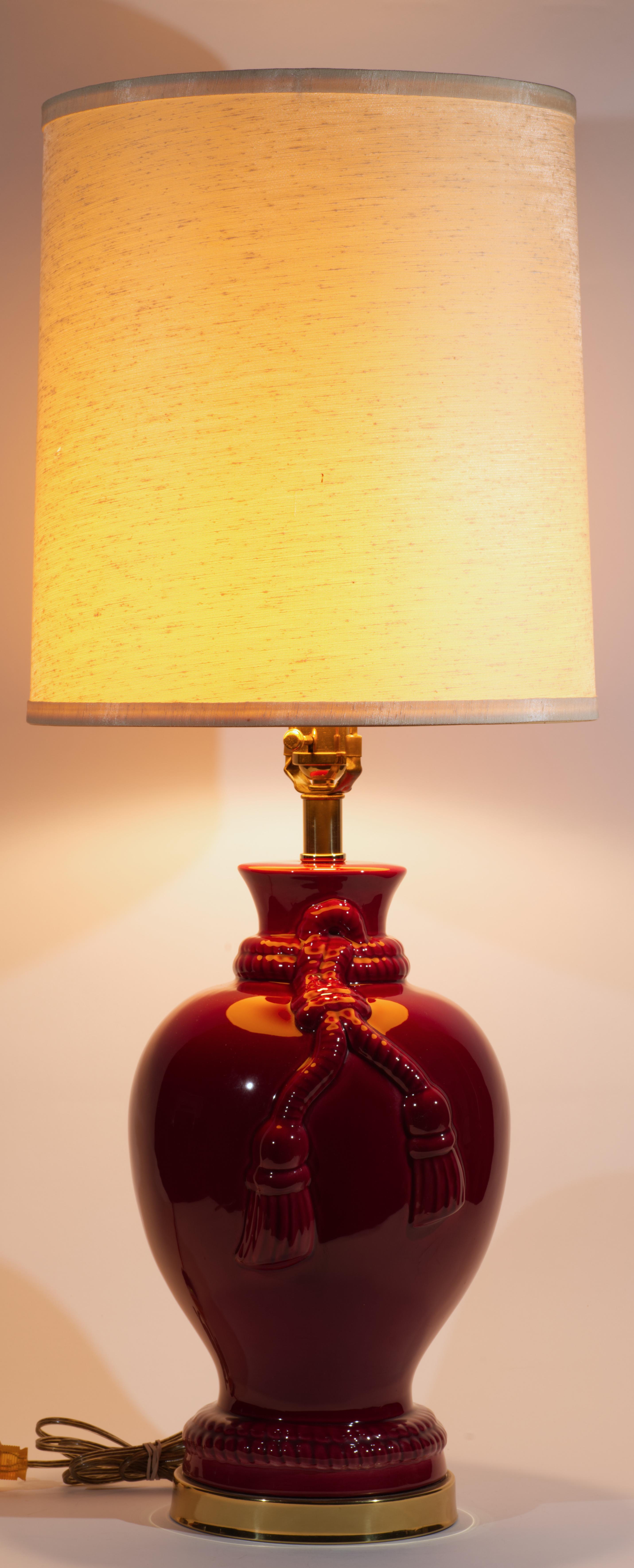 Mid-Century Modern Vintage Large Oxblood Red Ceramic Table Lamp with Tassel Relief For Sale