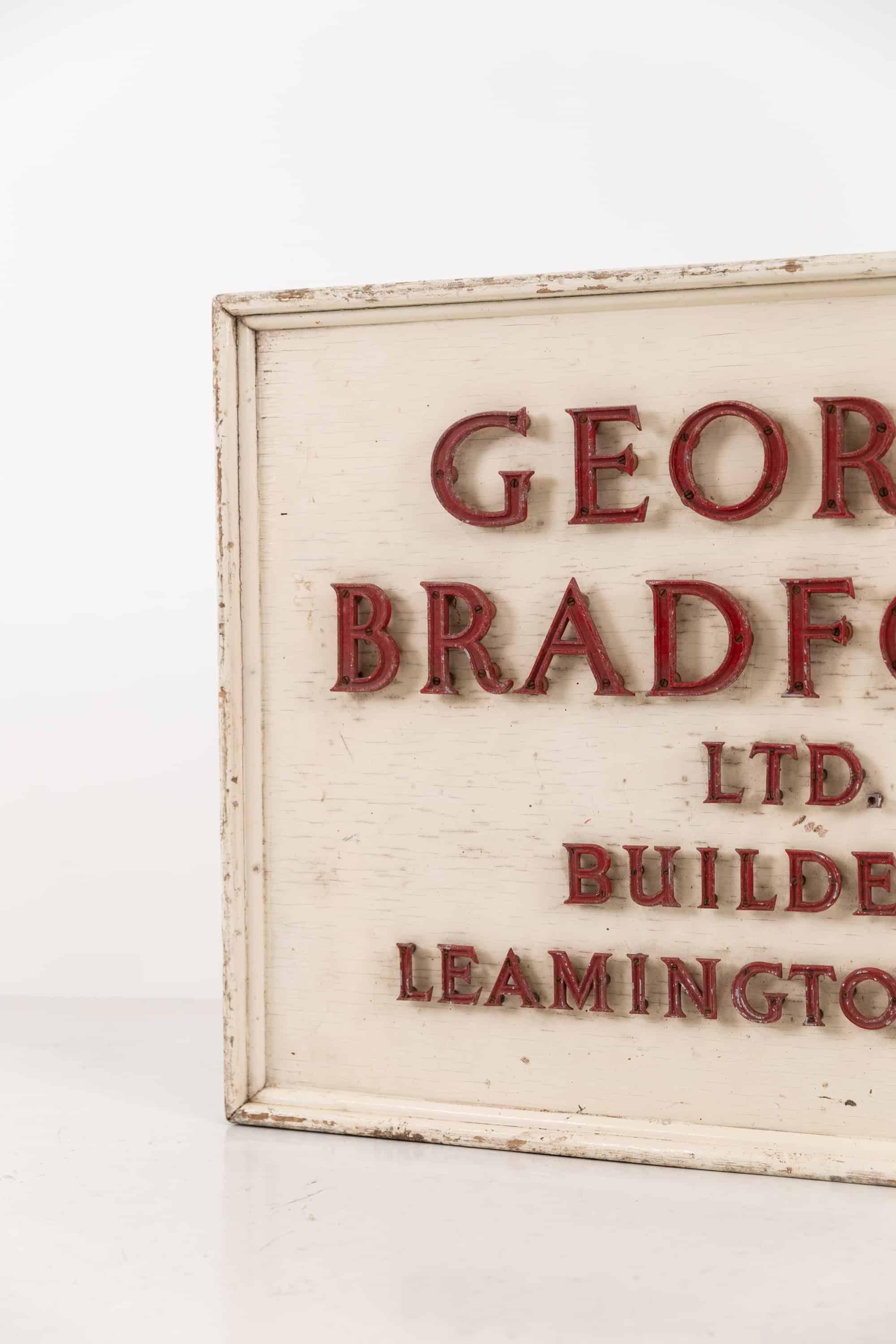 A large and unusual builders advertisement trade sign. circa 1940

Scratch built to the very highest quality for a builder local to Leamington Spa. Cast and painted letters mounted to white painted framed backboard with standoffs. All complete,