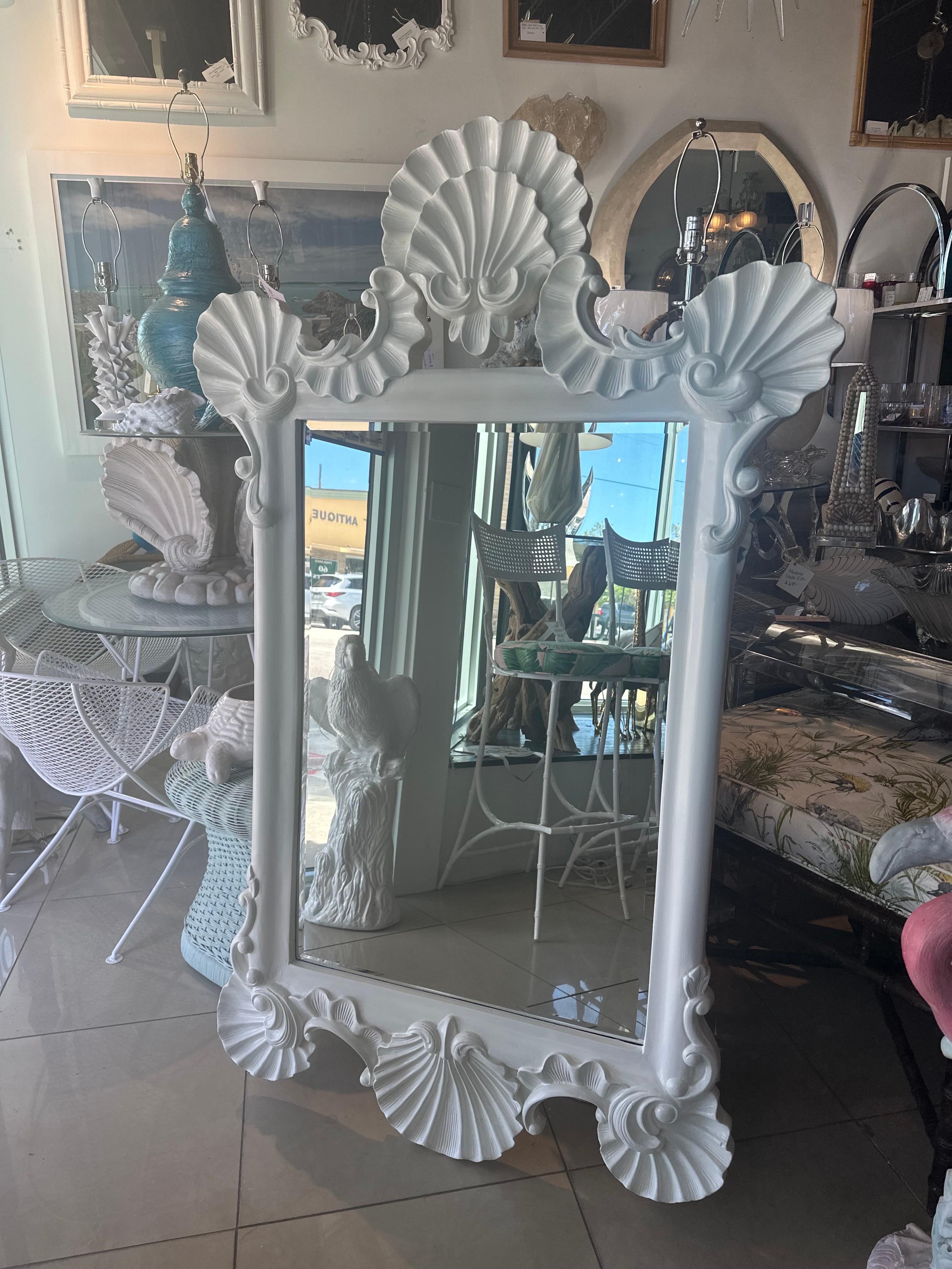 The most beautiful vintage seashell shell Palm Beach large ornate wall mirror. Newly lacquered in a soft white satin. New mounting hardware installed. Dimensions: 61 H x 37.5 W x 2.5 D. 