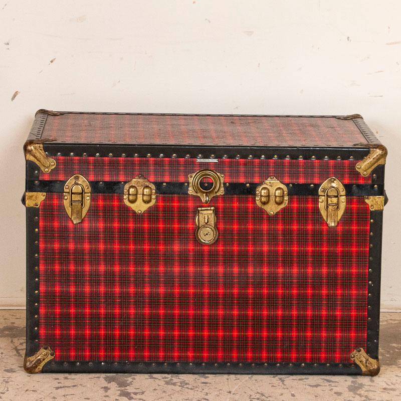 This vintage travel trunk makes one think of a travelling vaudeville act or packing for an ocean voyage. The label over the center lock reads, 