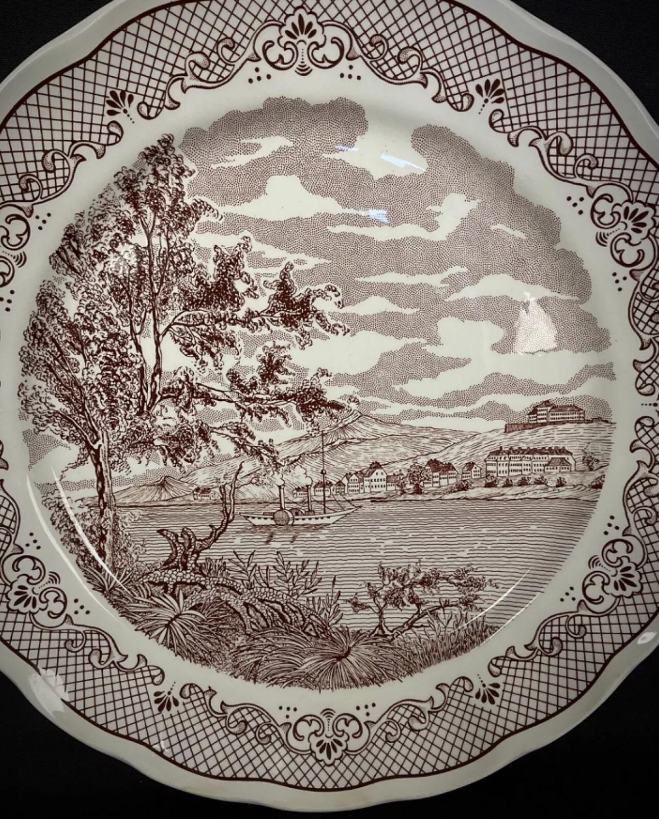 This vintage large round faience plate, marked 