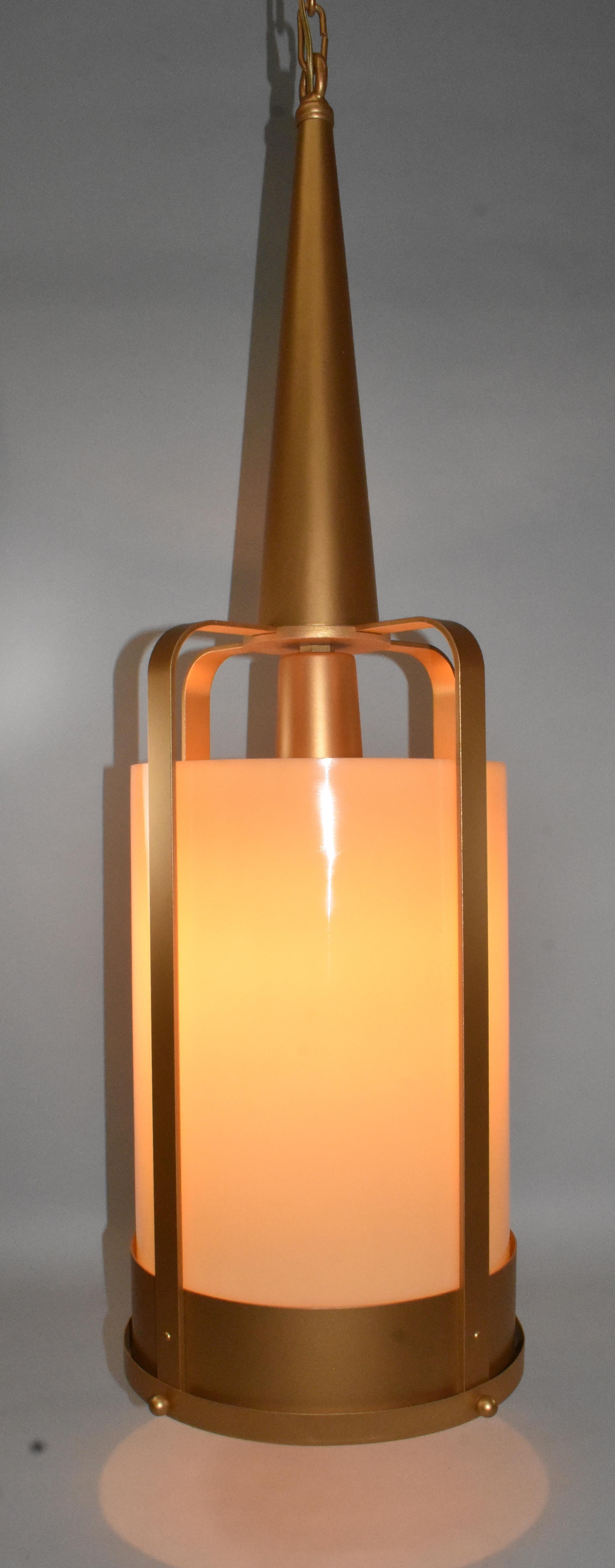 Vintage circa 1940s gold finish cylinder cage with thick amber glass shade. Cone shape top with four decorative balls on the open frame. Single socket.