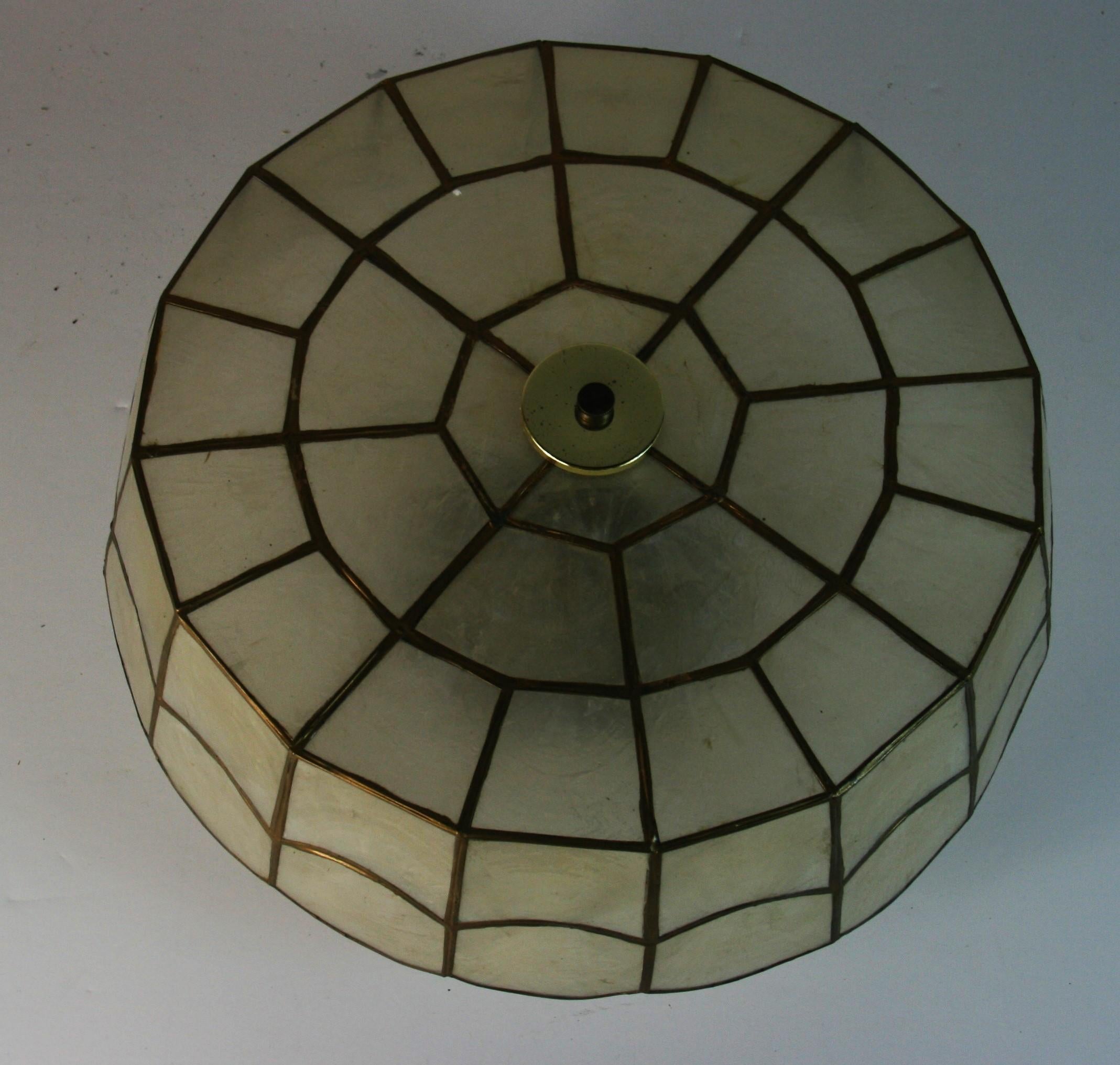 #1-2893 A large  scalloped capiz shell flush mount .

 Fixture takes 3 internal 60 watt edison  base bulbs
