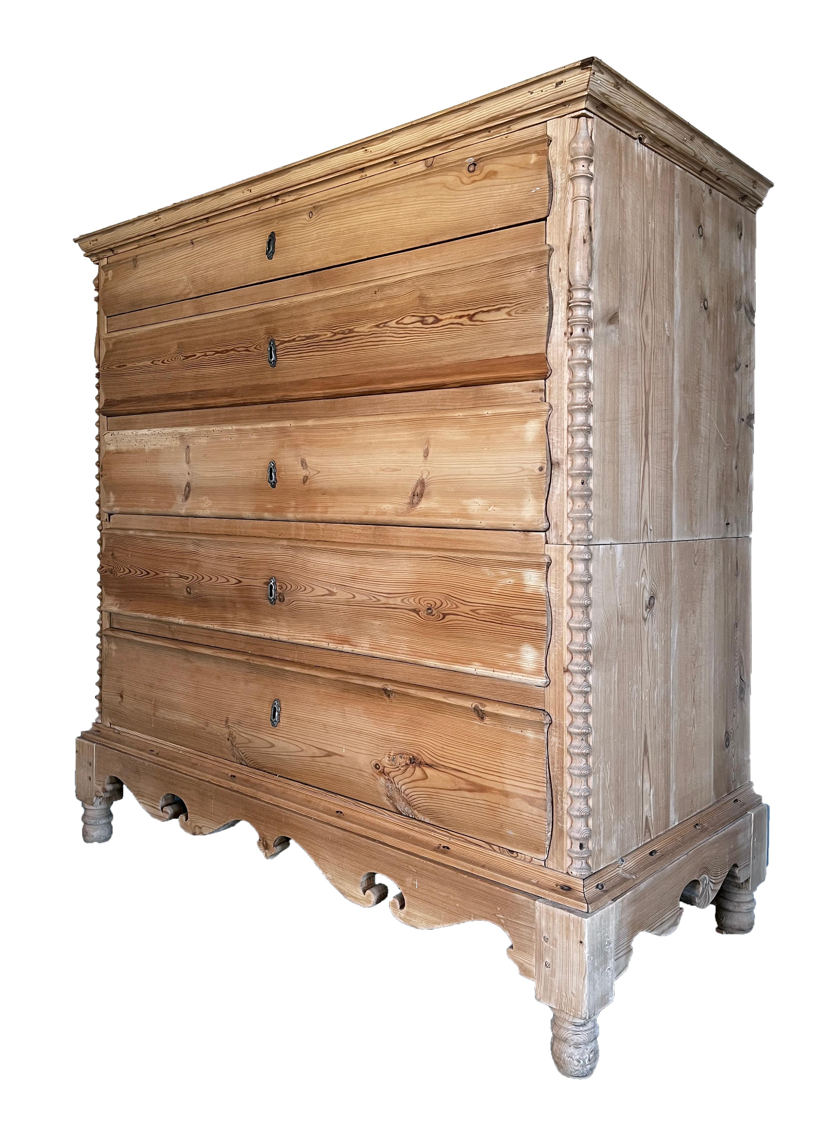 Antique 19th century Scandinavian chest of drawers in solid pine opening to 5 drawers. The top drawer is thinner and has compartments. The whole structure is divided into two parts assembled one on top of the other (see photos), which makes it