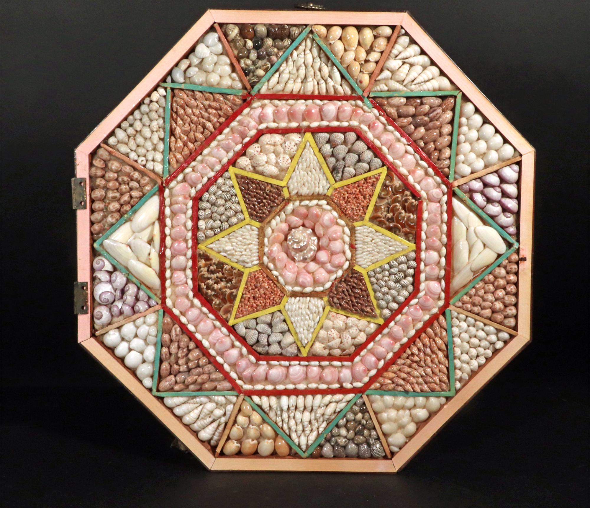Vintage Sailor's Valentine,
Shellwork,
20th Century.

The impressive Valentine shellwork has a cover which is now displayed separately.  The valentine is in an octagonal mahogany box and the shells are displayed, without glazing, in a diamond-shaped