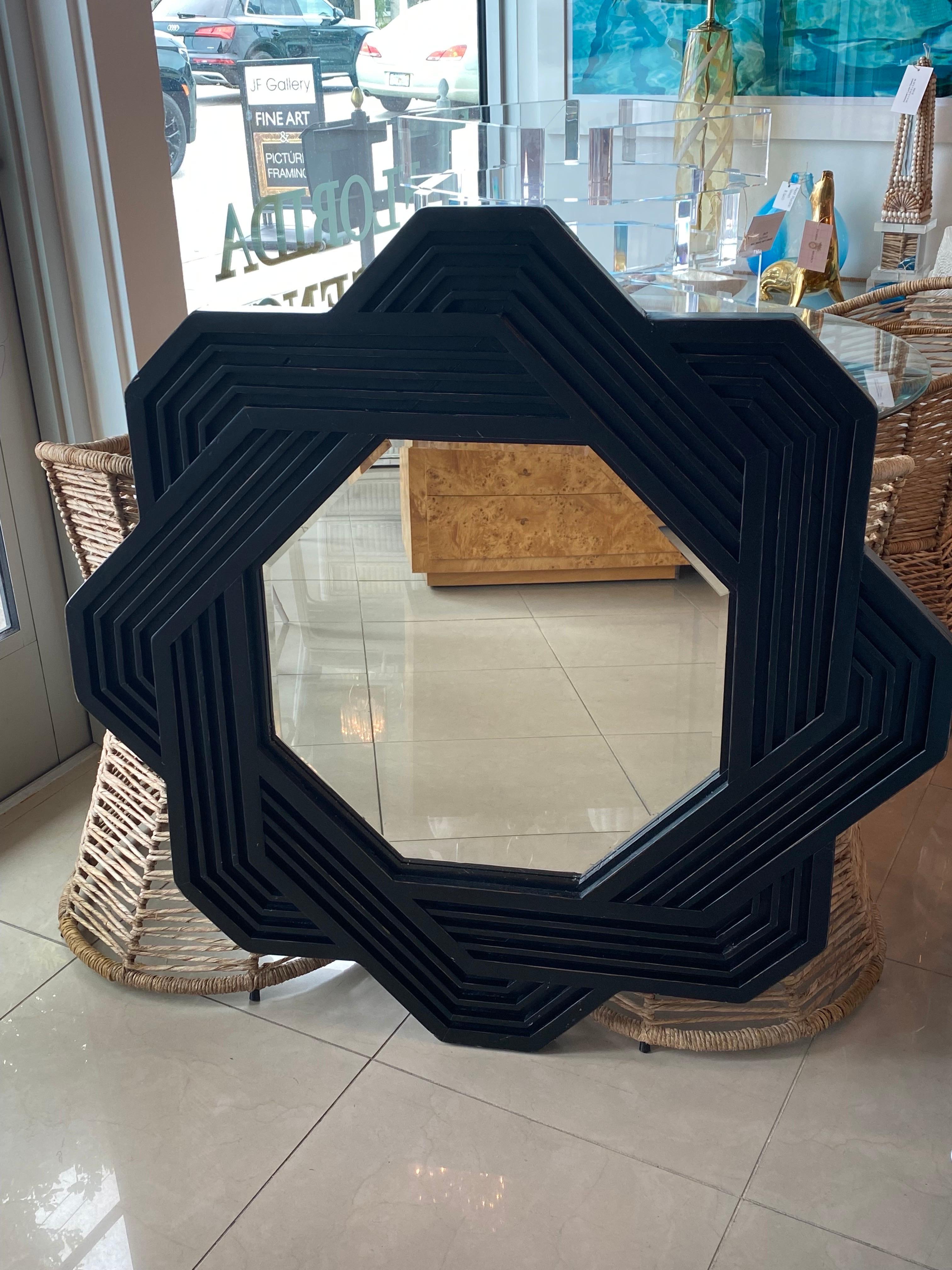 Beautiful vintage, solid wood, large geometric wall mirror. Original black finish may have minor imperfections. Can be lacquered in color of choice. Dimensions: 42 H x 42 W x 2 D.