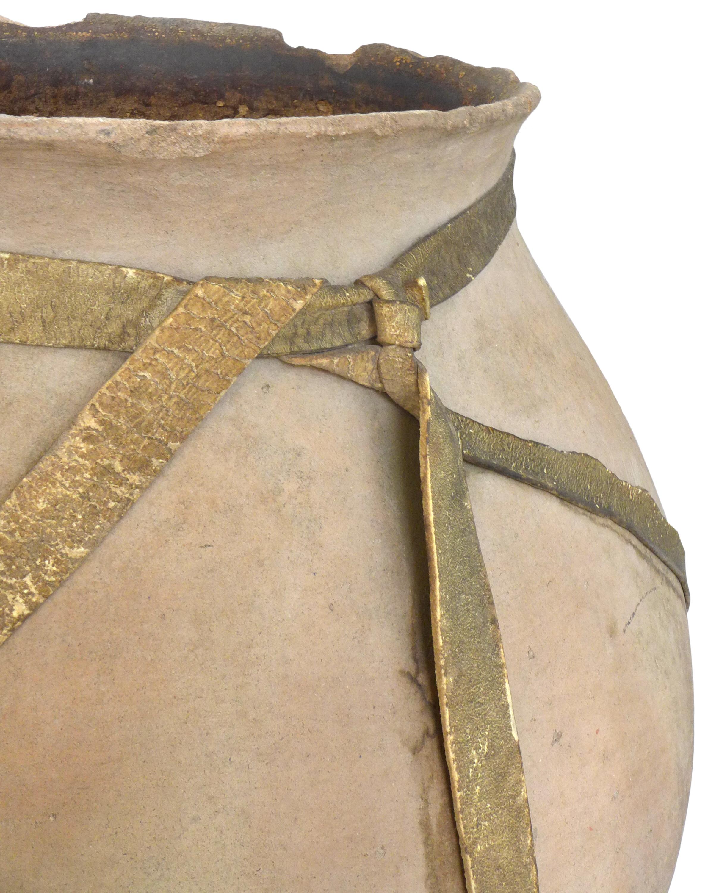 A fantastic vintage terracotta fermenting pot of the Tarahumara people, Copper Canyon, Northern Mexico. Deaccessioned from a museum collection, this vessel, called an olla, was used specifically to create the ceremonial, fermented corn drink