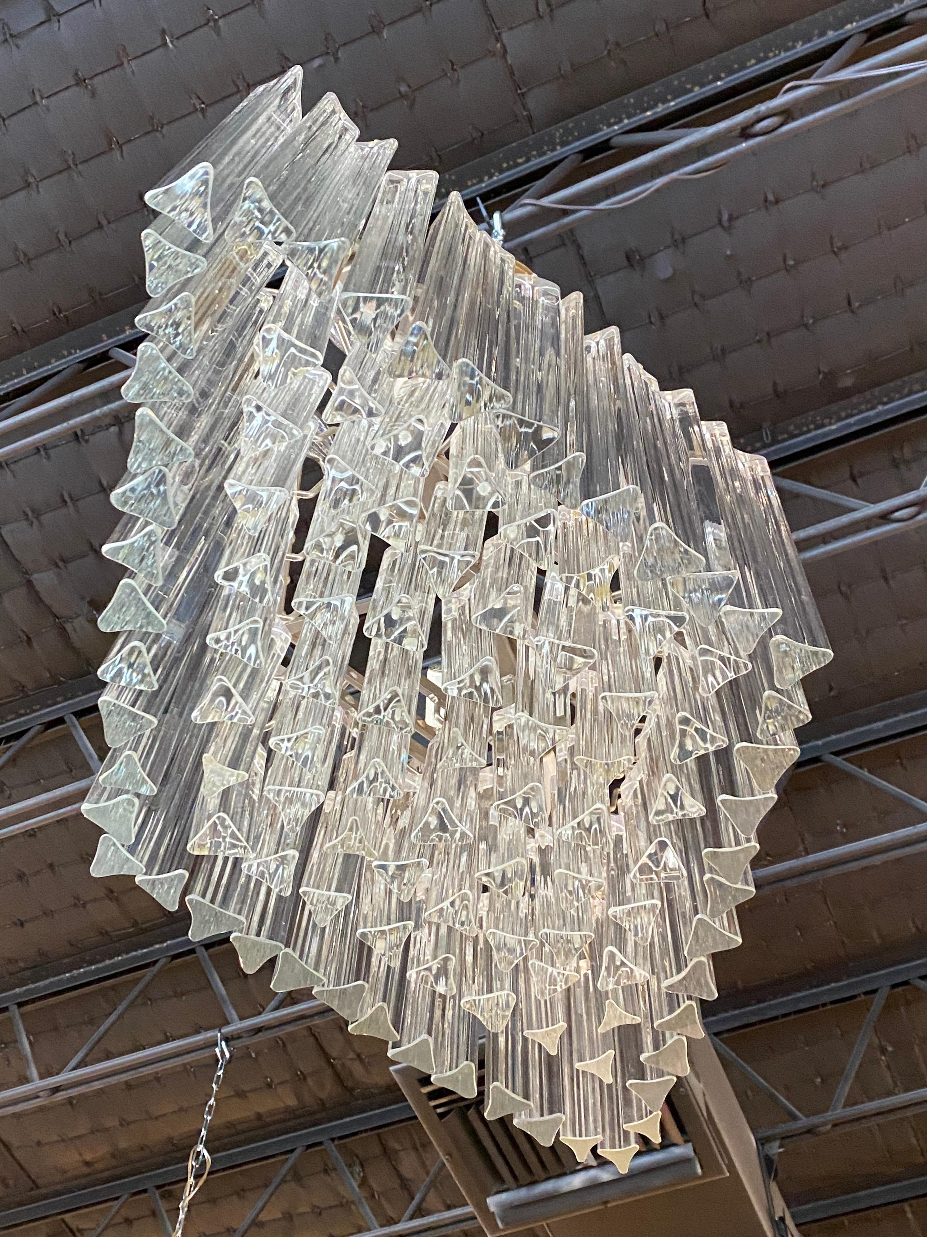 Beautiful large vintage Murano Camer chandelier. Holds 6 light bulbs. Has 104 glass tri lobe pieces with no broken or chipped glass. Chandelier cage metal may have some patina. Tested, working order. All glass pieces will be cleaned prior to