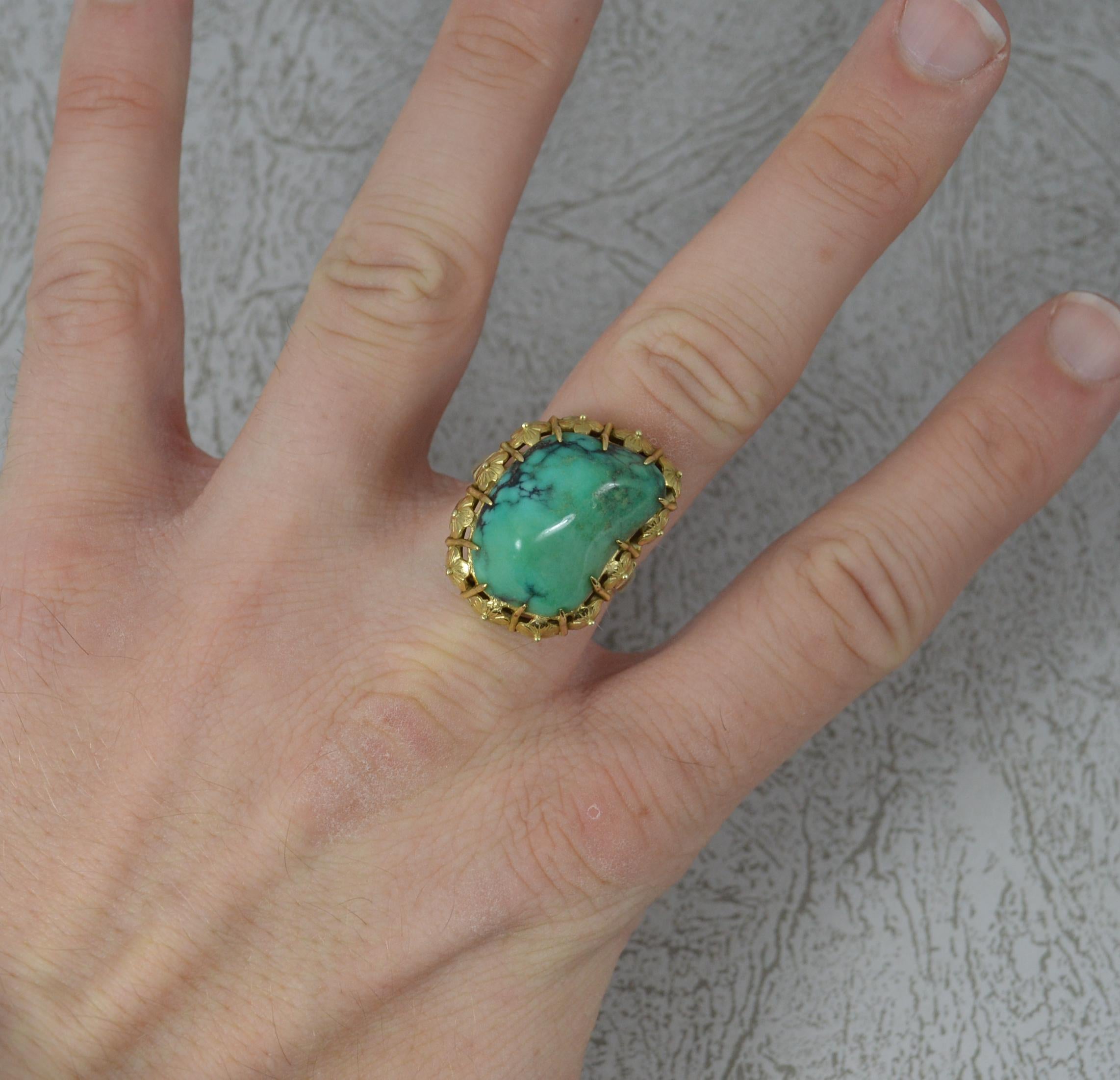 A stylish vintage statement ring.
Solid 14 carat yellow gold example.
Set with a single natural turquoise stone in multi claw setting. 14mm x 21mm stone approx.

CONDITION ; Very good for age. Clean shank. Well set stones. Great example. Issue free.