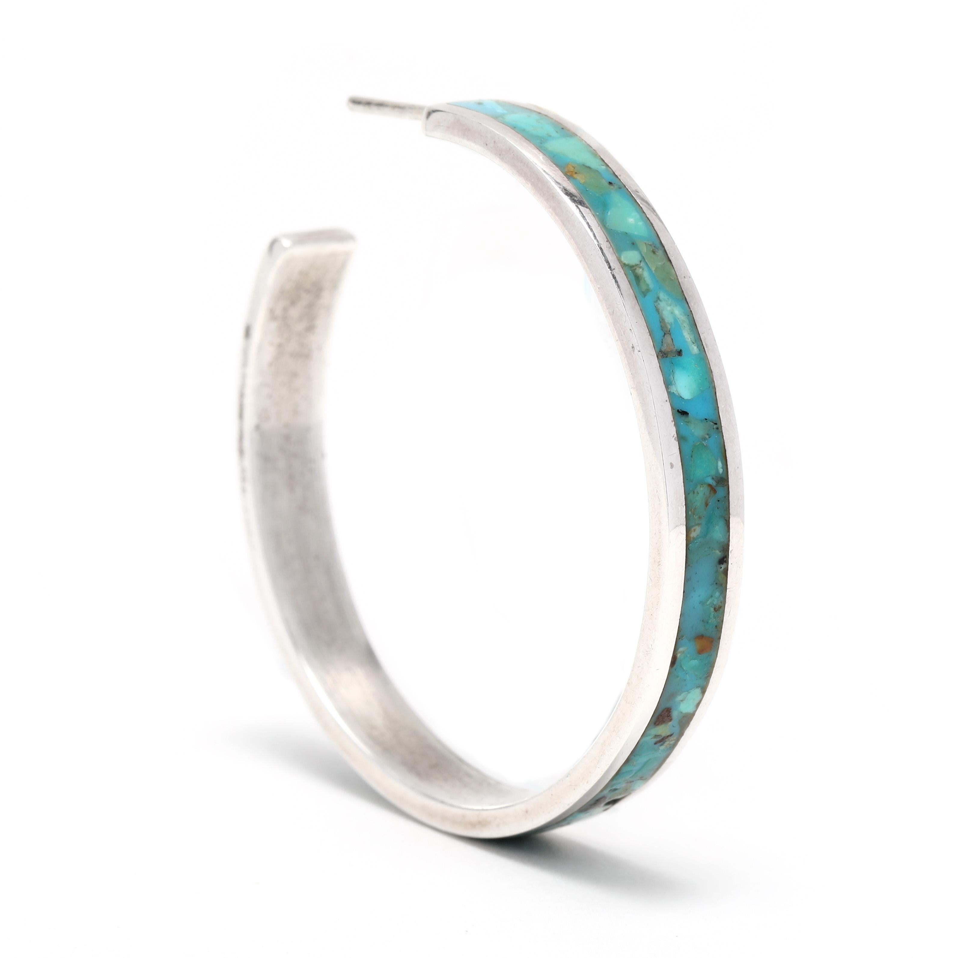 These gorgeous vintage turquoise mosaic hoop earrings are the perfect way to add a touch of southwestern style to any look. Crafted from sterling silver, these earrings feature a vibrant turquoise inlay and measure 1.5 inches in length. The thin