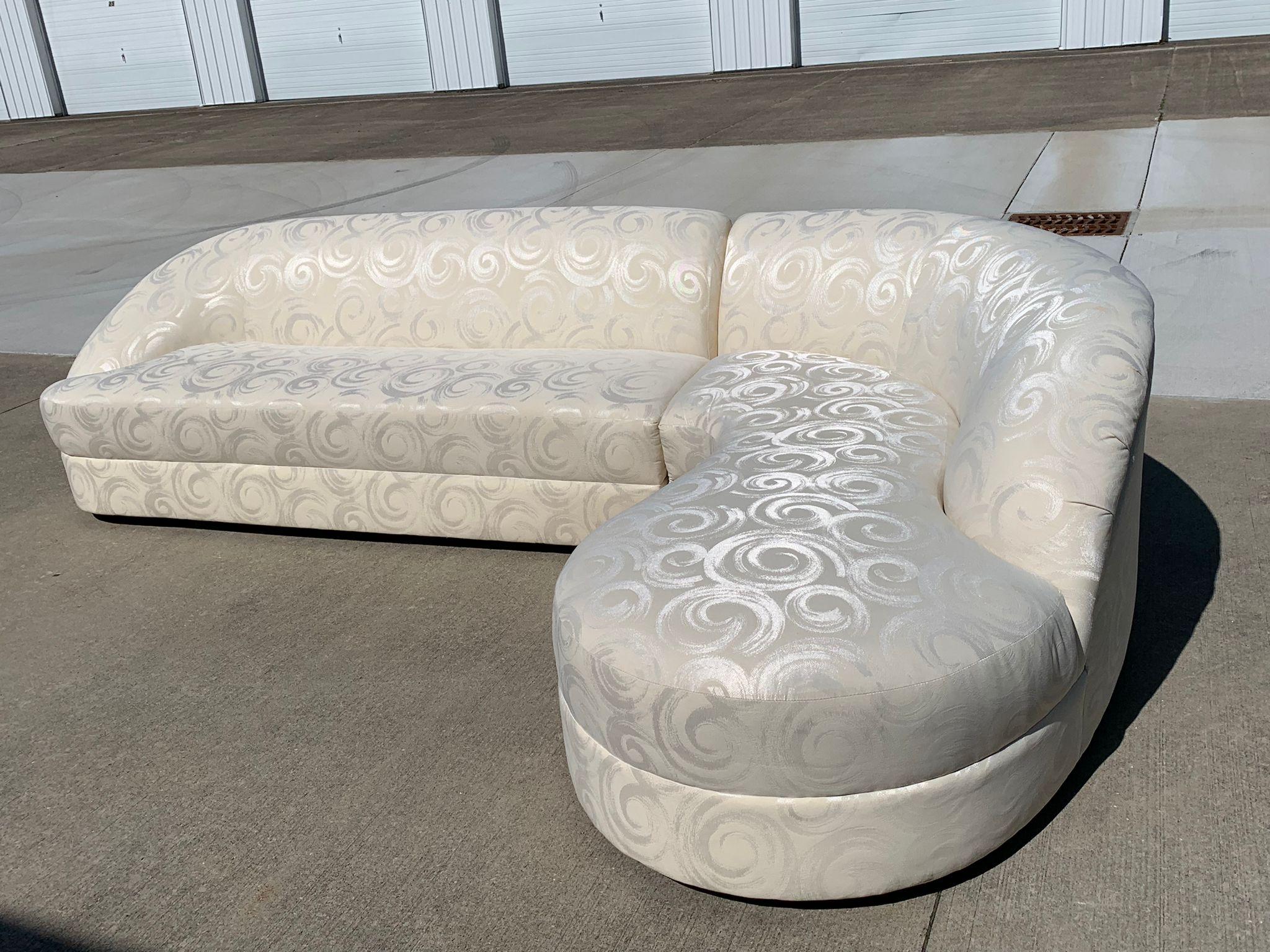 Beautiful vintage two-piece Postmodern Curved Sectional in its original unique fabric - An off-white performance fabric with a textured swirl design. In great condition but it is vintage so it won't be perfect. But who doesn't love a good curved