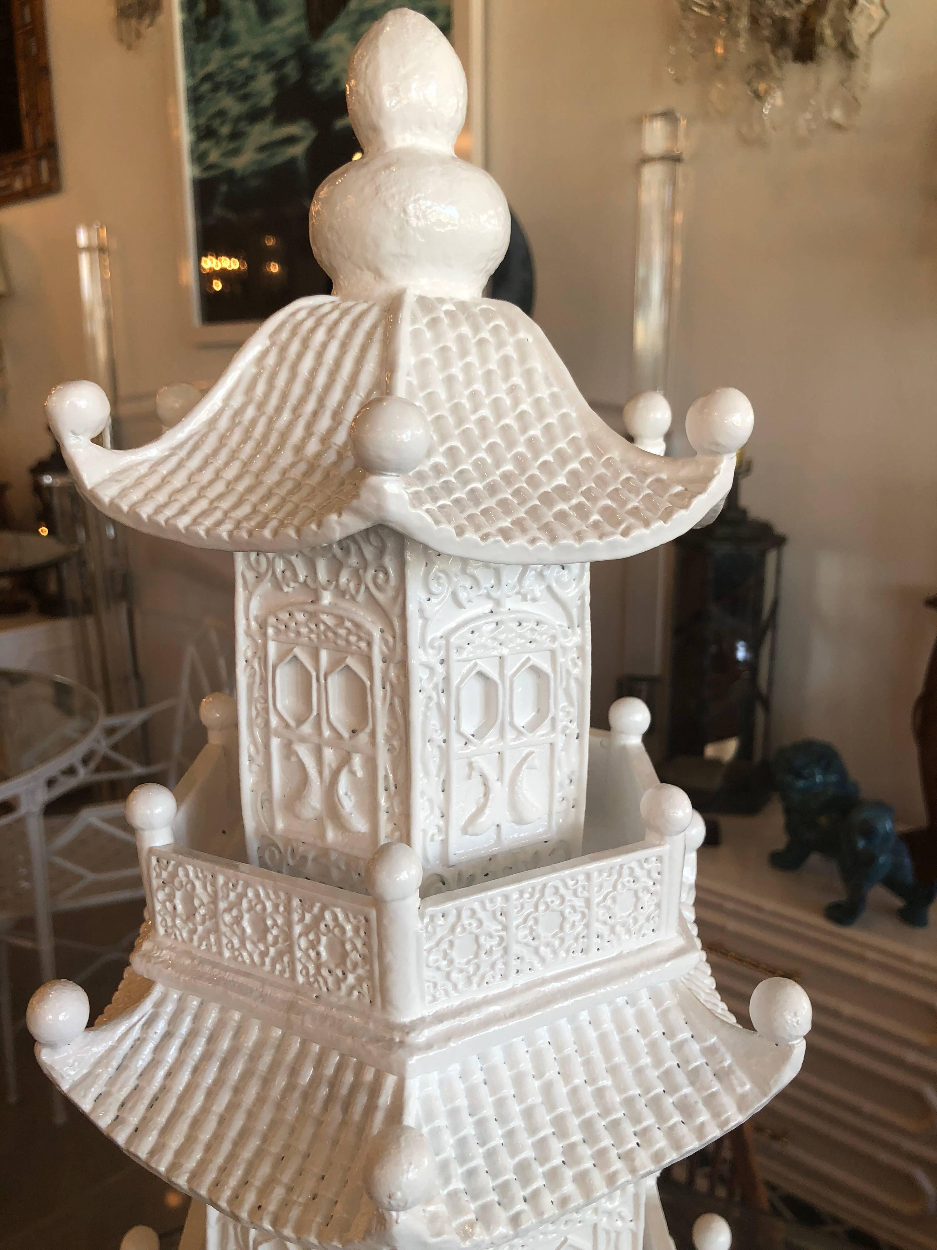 Vintage large pagoda chinoiserie statue. This can be placed inside or in the garden. Refinished in a lacquered white. Heavy piece made of some sort of composite.