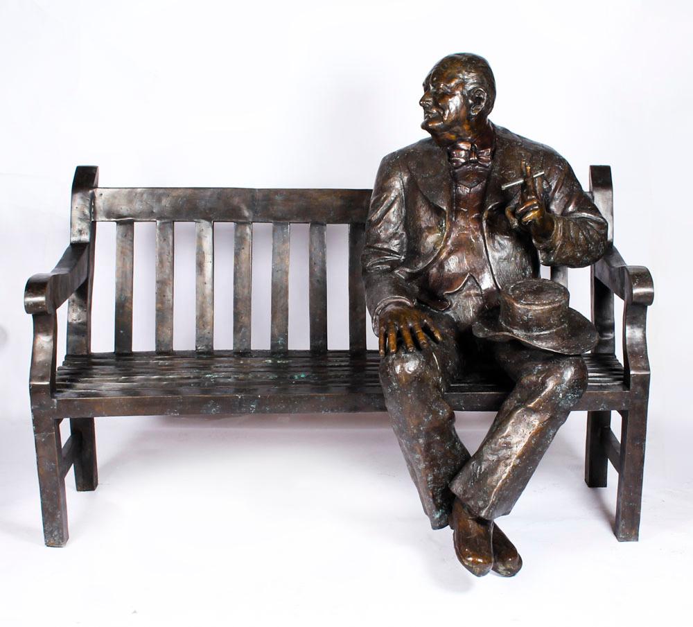 This is an stunning larger than a life-size vintage statue of the Prime Minister of the United Kingdom from 1940 to 1945, Winston Churchill, in a relaxed and informal way on an outdoor bench, dating from the second half of the 20th century. 

This