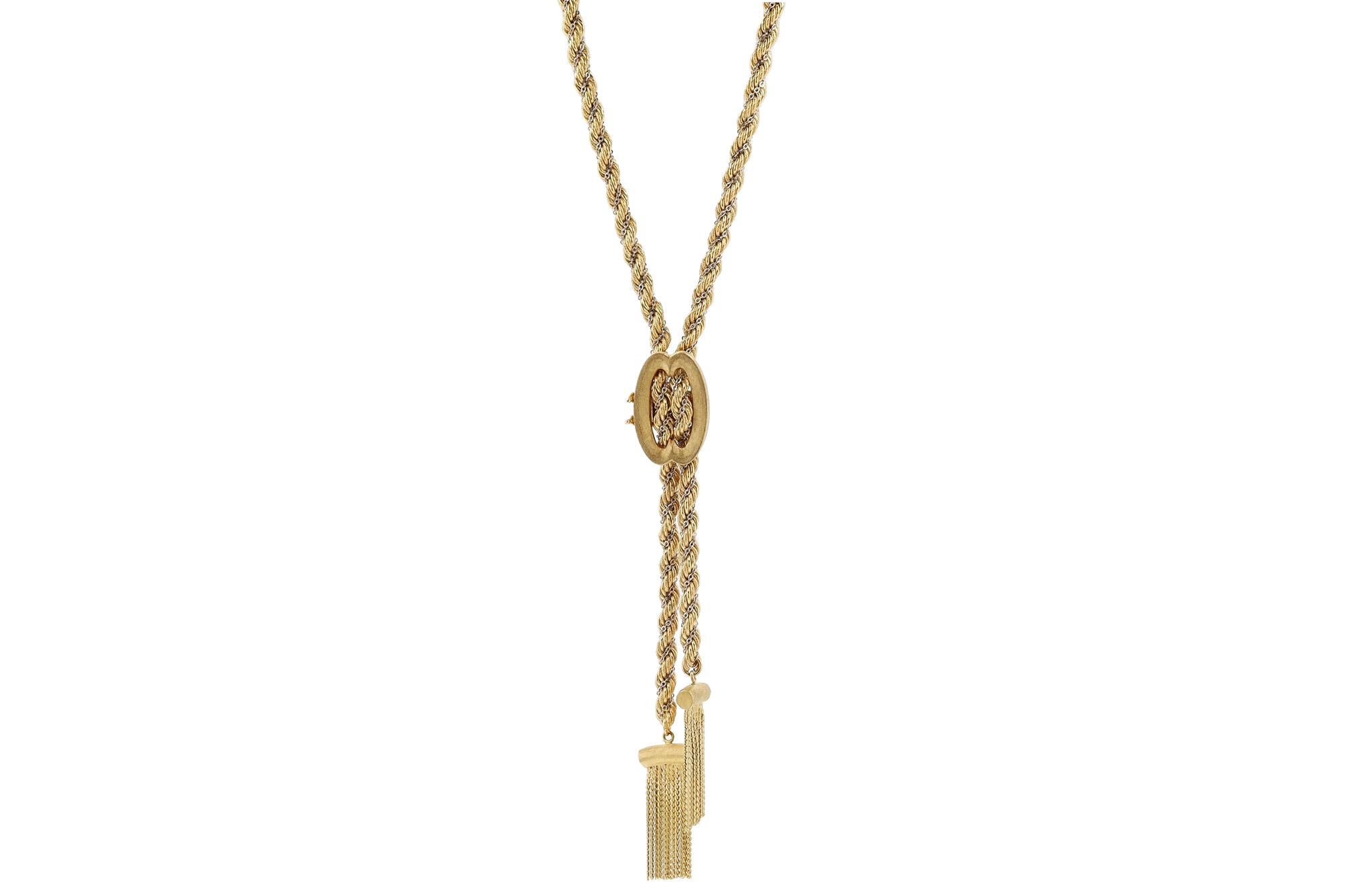 This lengthy and luxurious lariat necklace is a head turning 38 inches long, 1970s vintage in nearly new condition. Featuring a  two tone twisted rope chain and a florentine finish bolo allowing styling adjustment. The sustainable 18 karat yellow