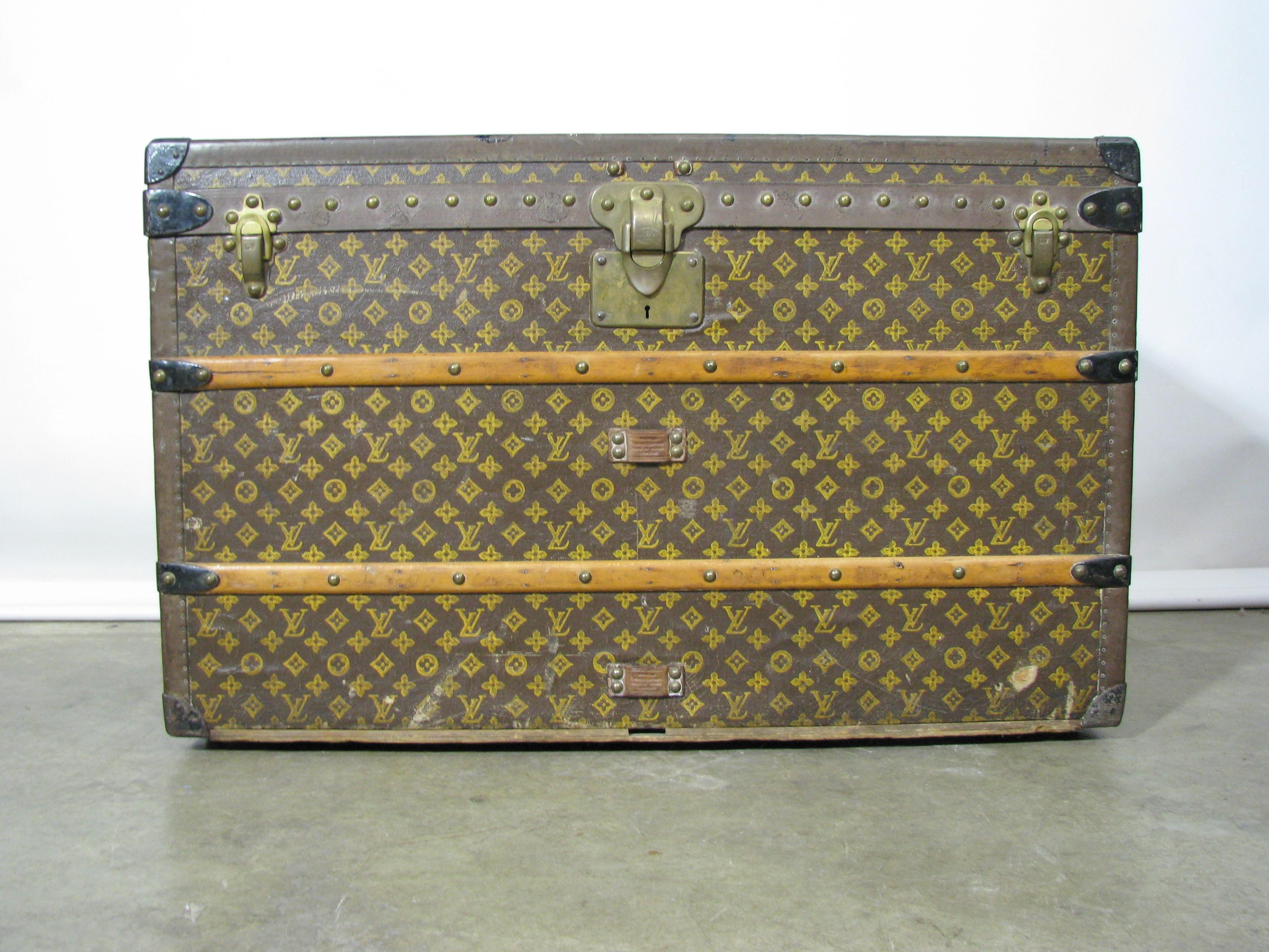 Late 1920s Louis Vuitton steamer trunk with stenciled monogram canvas. It features solid brass hardware, latches and locks - and the 