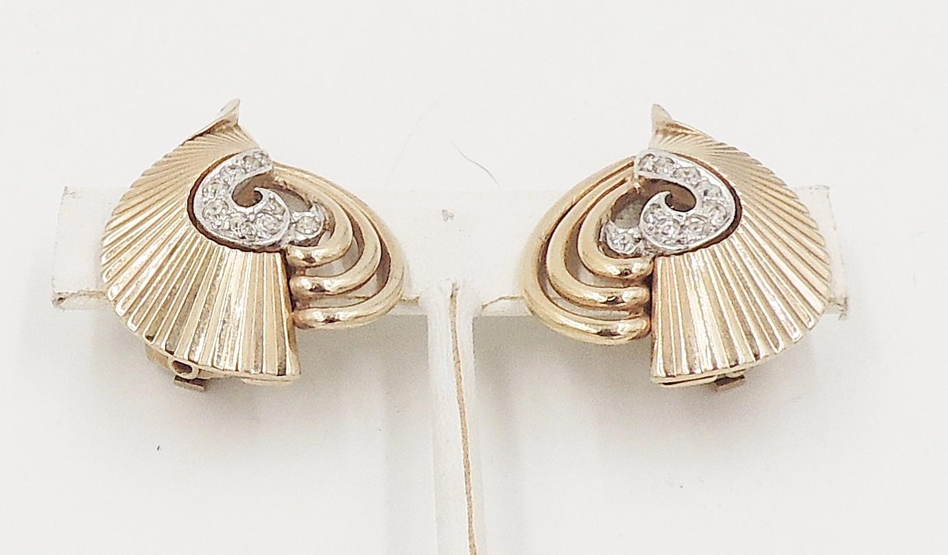Late 1950s goldtone textured clear rhinestone clip back earrings. Marked 
