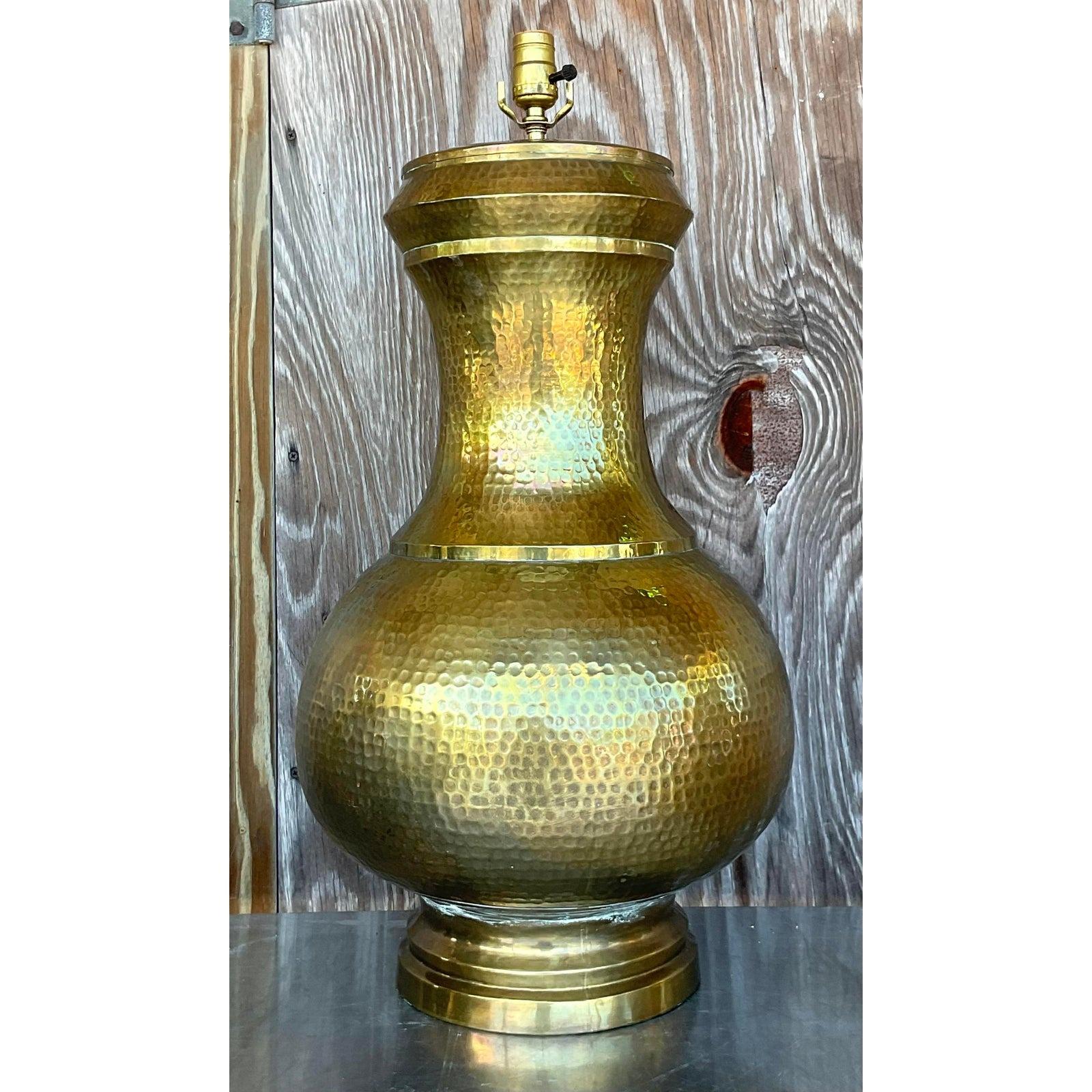 A spectacular vintage Boho table lamp. A chic hammered brass in a gourd shape. Monumental in size and drama. Acquired from a Palm Beach estate.