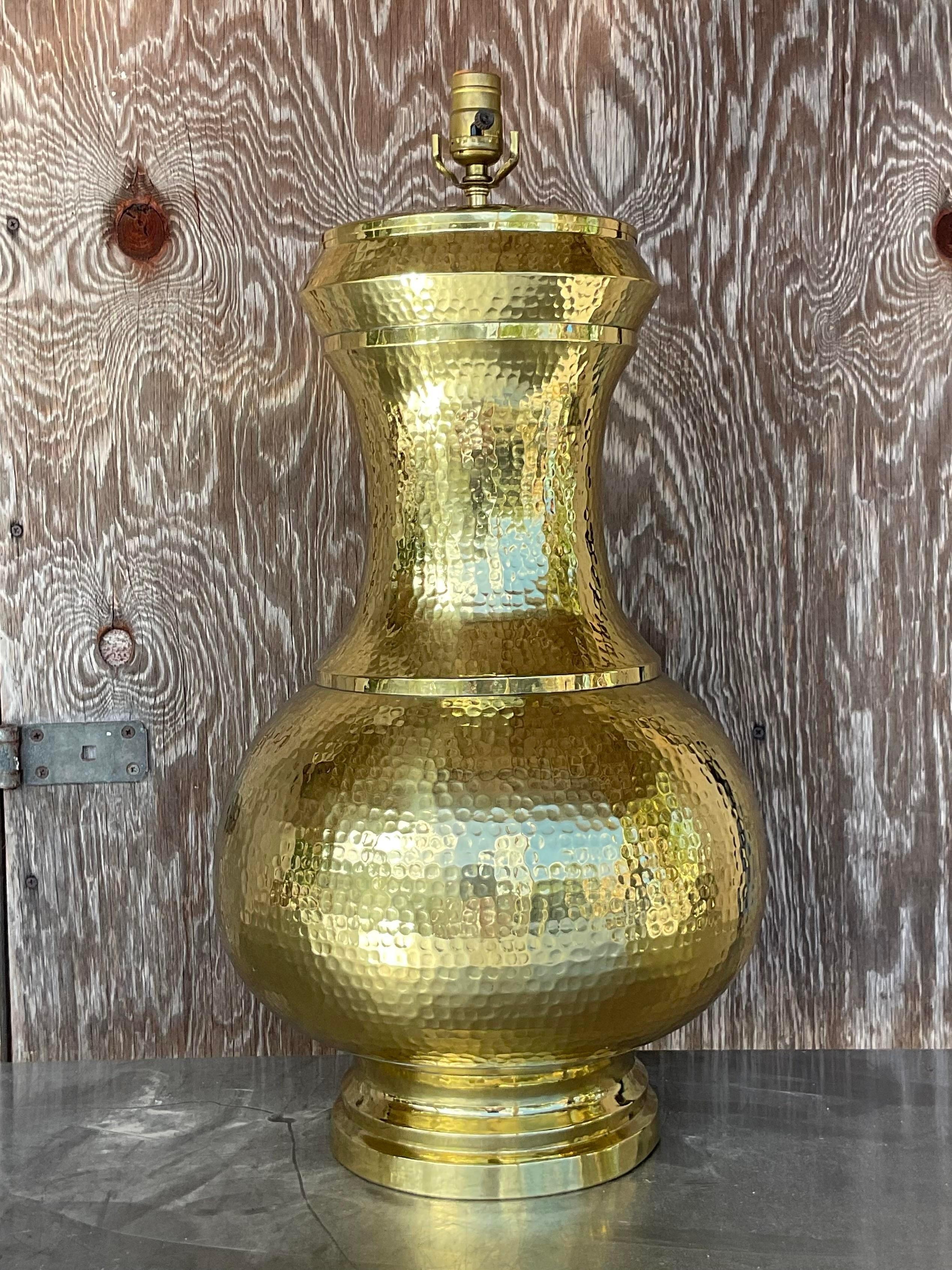 A stunning vintage Boho table lamp. Monumental in size and drama. Chic hammered brass in a gorgeous gourd shape. Freshly polished. Acquired from a palm Beach estate.