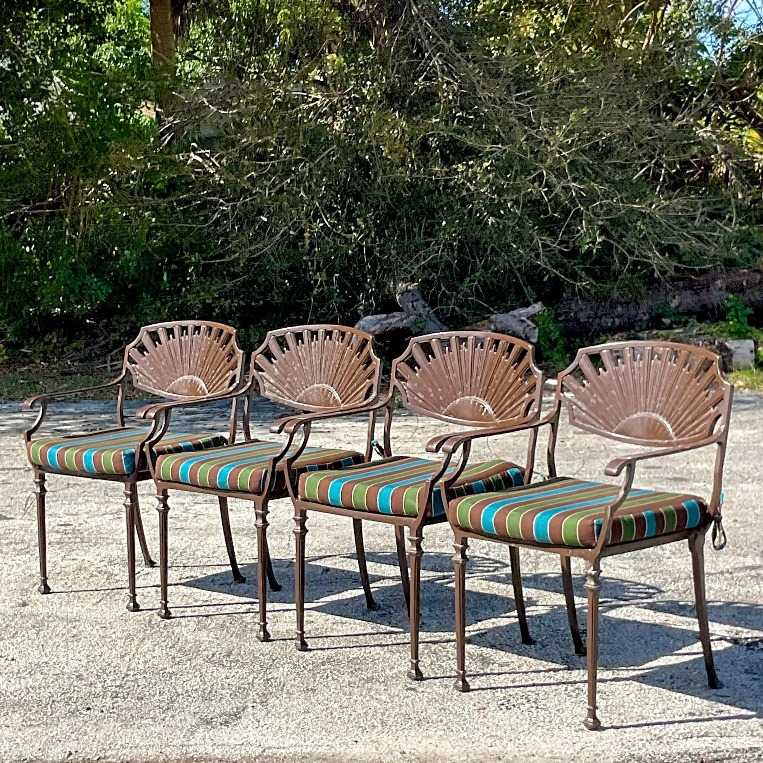 A fabulous vintage Coastal dining set for four. A chic fan back design on a wrought iron frame. Coordinating ring on the table pedestal. Acquired from a Palm Beach estate.

Table 60x60x30.5
Seat height 19.5