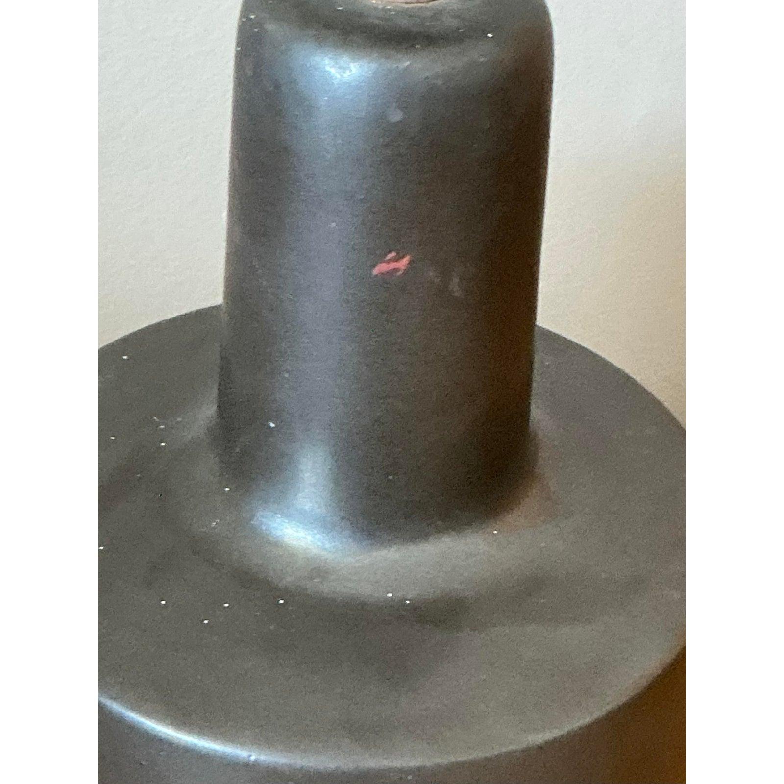 A true icon of American studio pottery, this vintage table lamp was designed by the celebrated duo Jane and Gordon Martz for Marshall Studios. The piece showcases the minimalist, sculptural silhouette that made Martz pottery a cornerstone of the