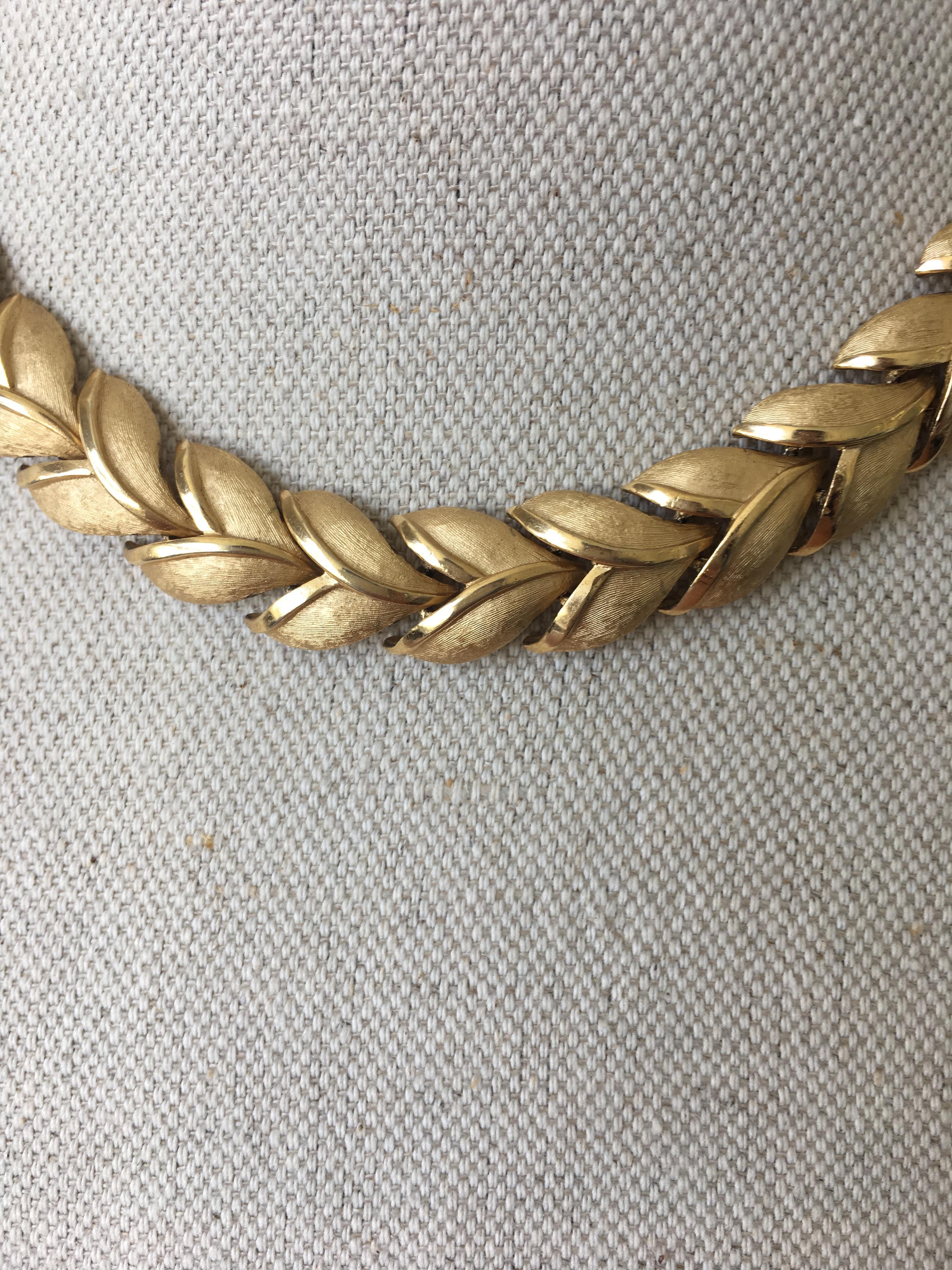 Vintage Laurel leaf necklace by Trifari, circa 1960.
Marked 'Trifari' with copyright symbol and crown T hang tag.

Provenance: Acquired from the Private Collection of Caroline, Countess de Cabarrus, London, United Kingdom