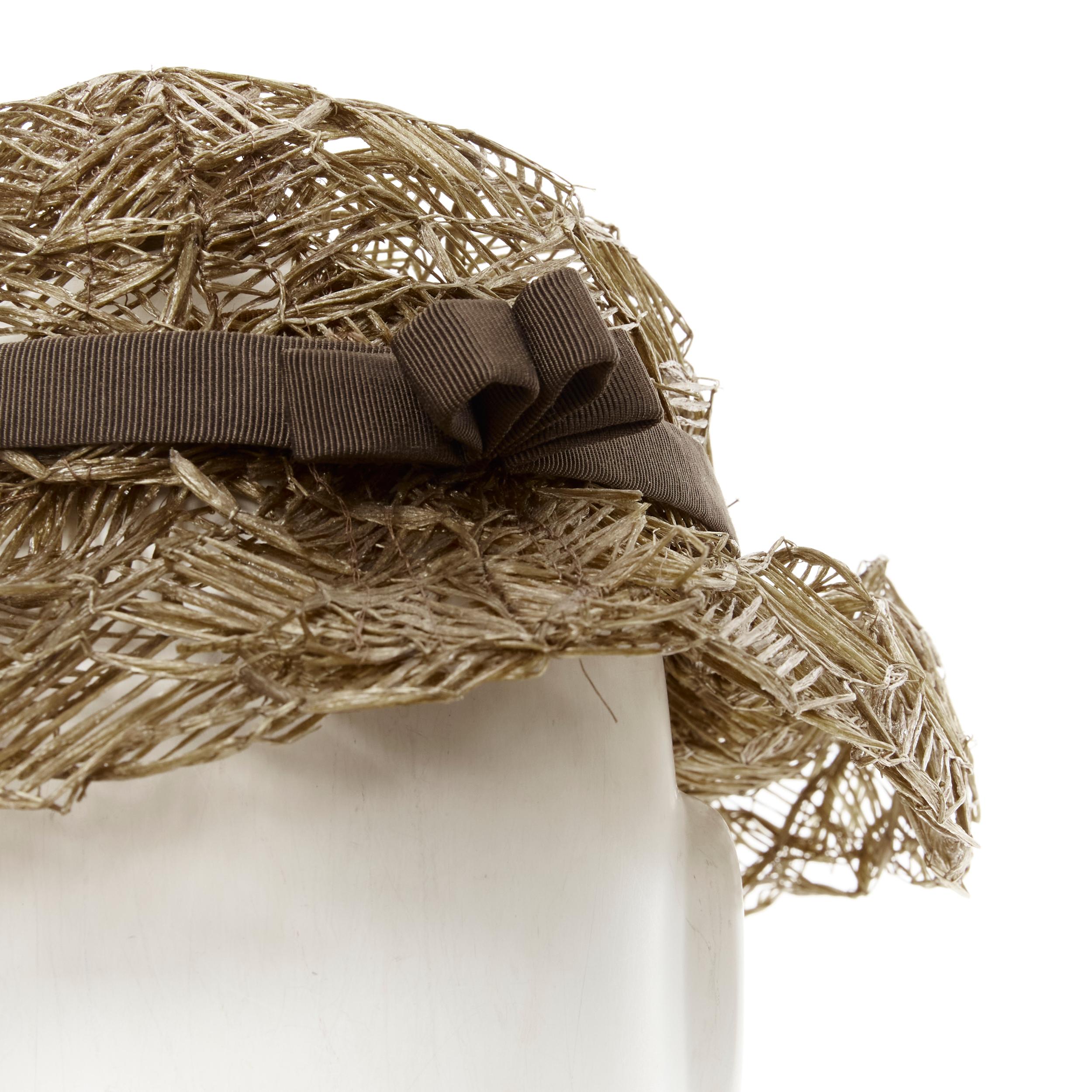 vintage LAURENCE PARIS brown straw raffia woven bow grosgrain boater hat 
Reference: CRTI/A00535 
Brand: Laurence 
Material: Raffia 
Pattern: Solid 
Extra Detail: Brown grosgrain trimming. 
Made in: Paris 

CONDITION: 
Condition: Excellent, this