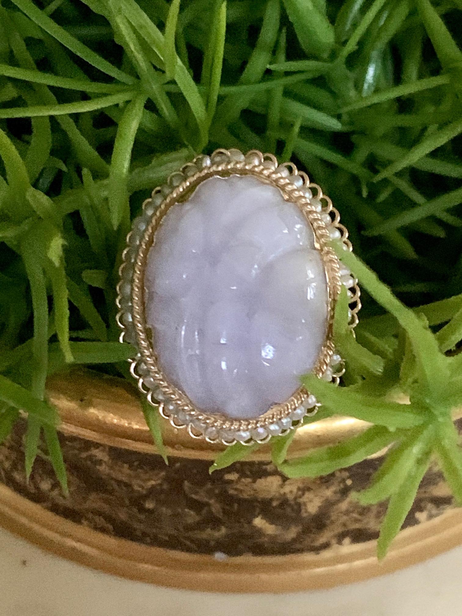 This beautifully carved Lavender Jade stone is encircled by a halo of Seed Pearls to really set off the beautiful Lavender color of the stone. The stone just 