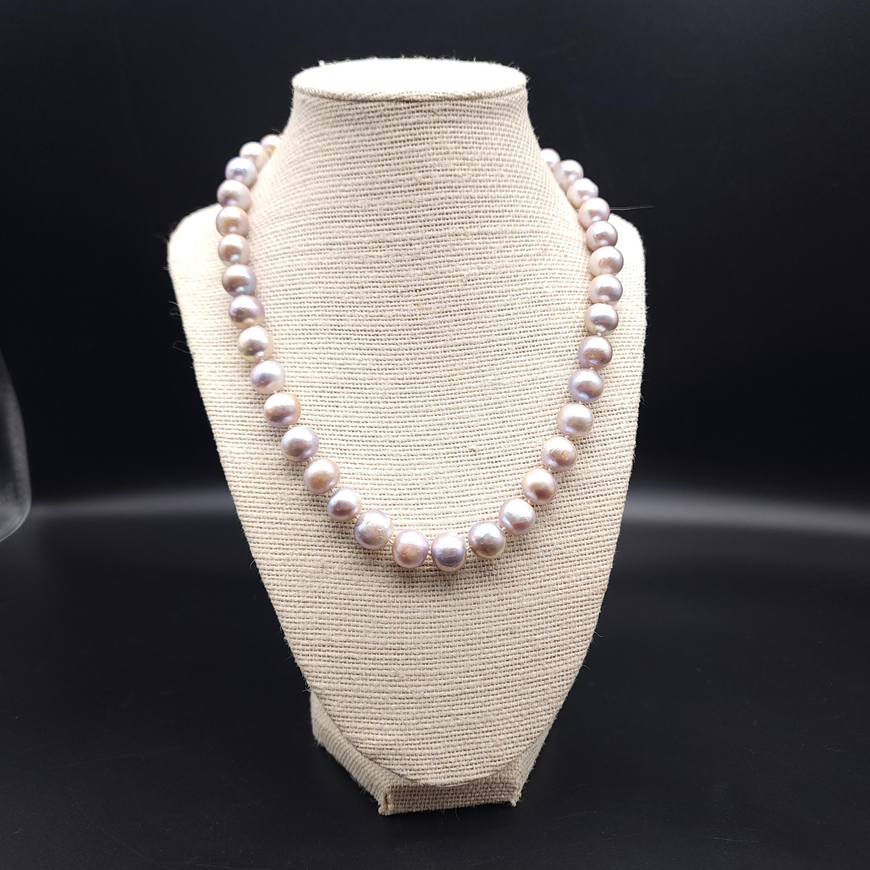 Necklace length: 47cm / 18.5 inches
Cultured pearl, approx 1cm each
Color: Assortment of lavender shades
Marks / Hallmarks: 925 on clasp

Indulge in timeless elegance with our vintage cultured pearl bead necklace. Each lustrous pearl exudes